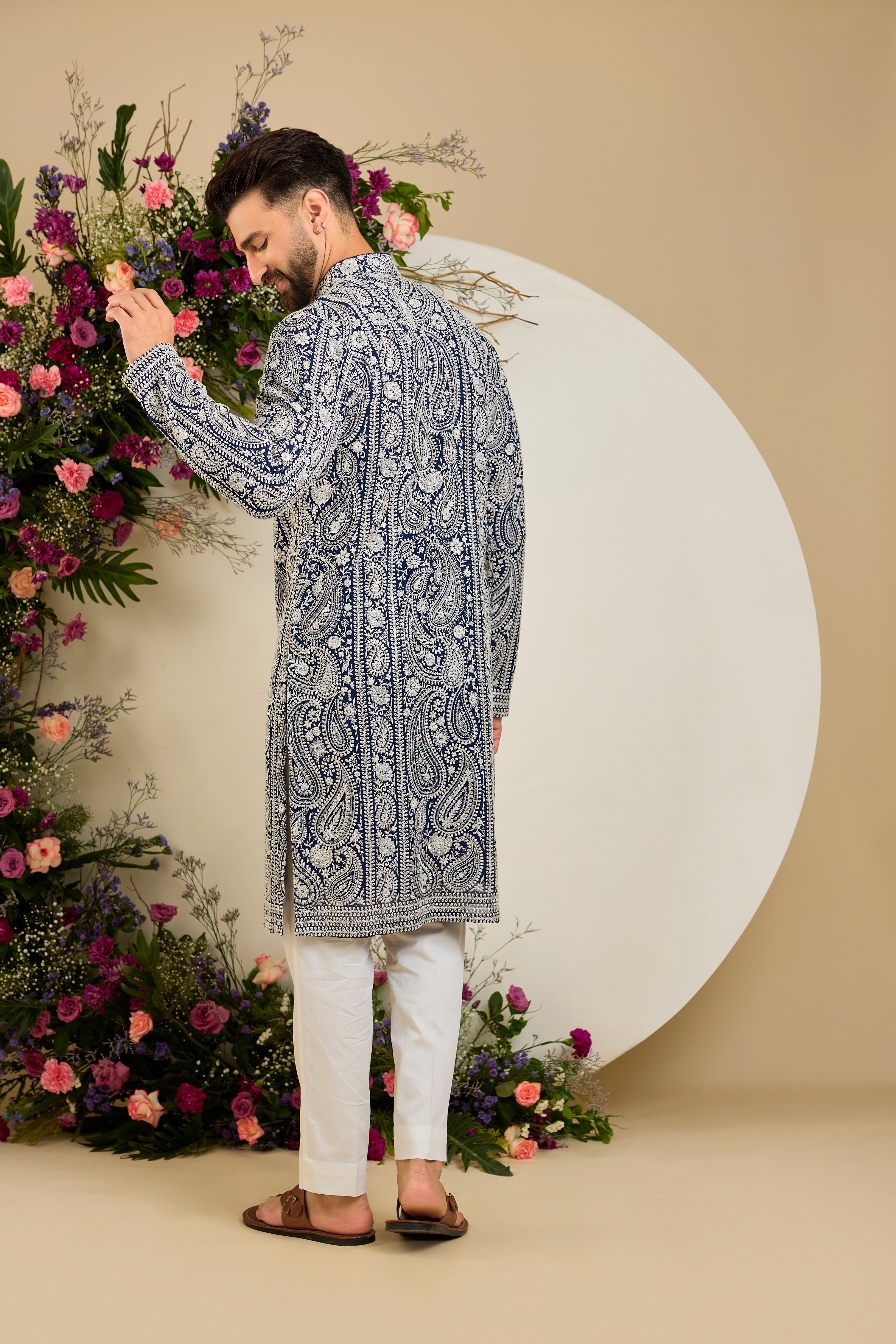 Royal blue Chikankari kurta with paisley embroidery, ivory and white threadwork, and delicate sequin detailing for timeless elegance.