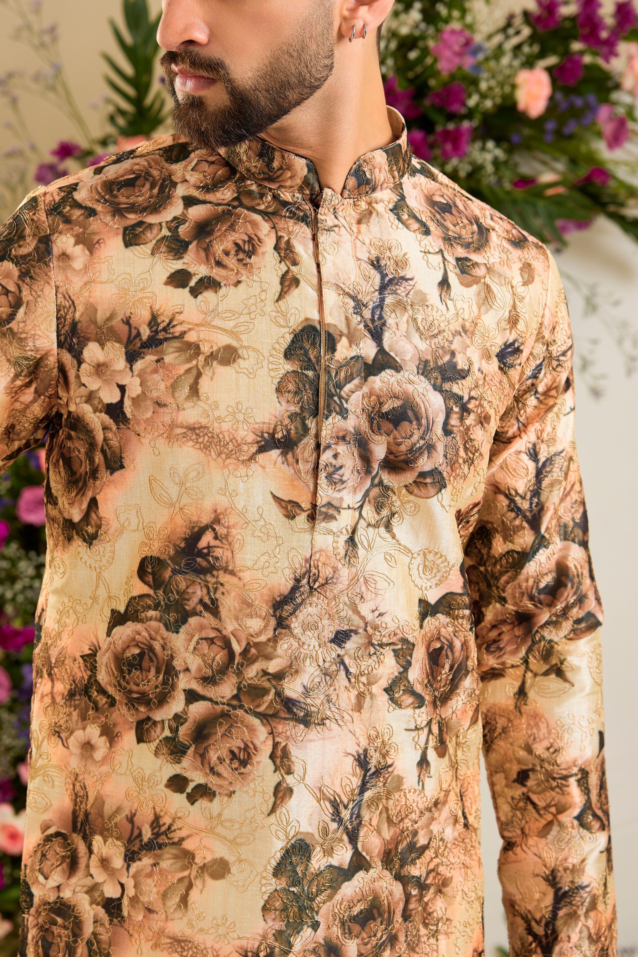 Showcasing a vibrant multi-coloured floral backdrop, this short kurta is elevated with refined aari craftsmanship .An exceptional expression of contemporary couture and timeless elegance.