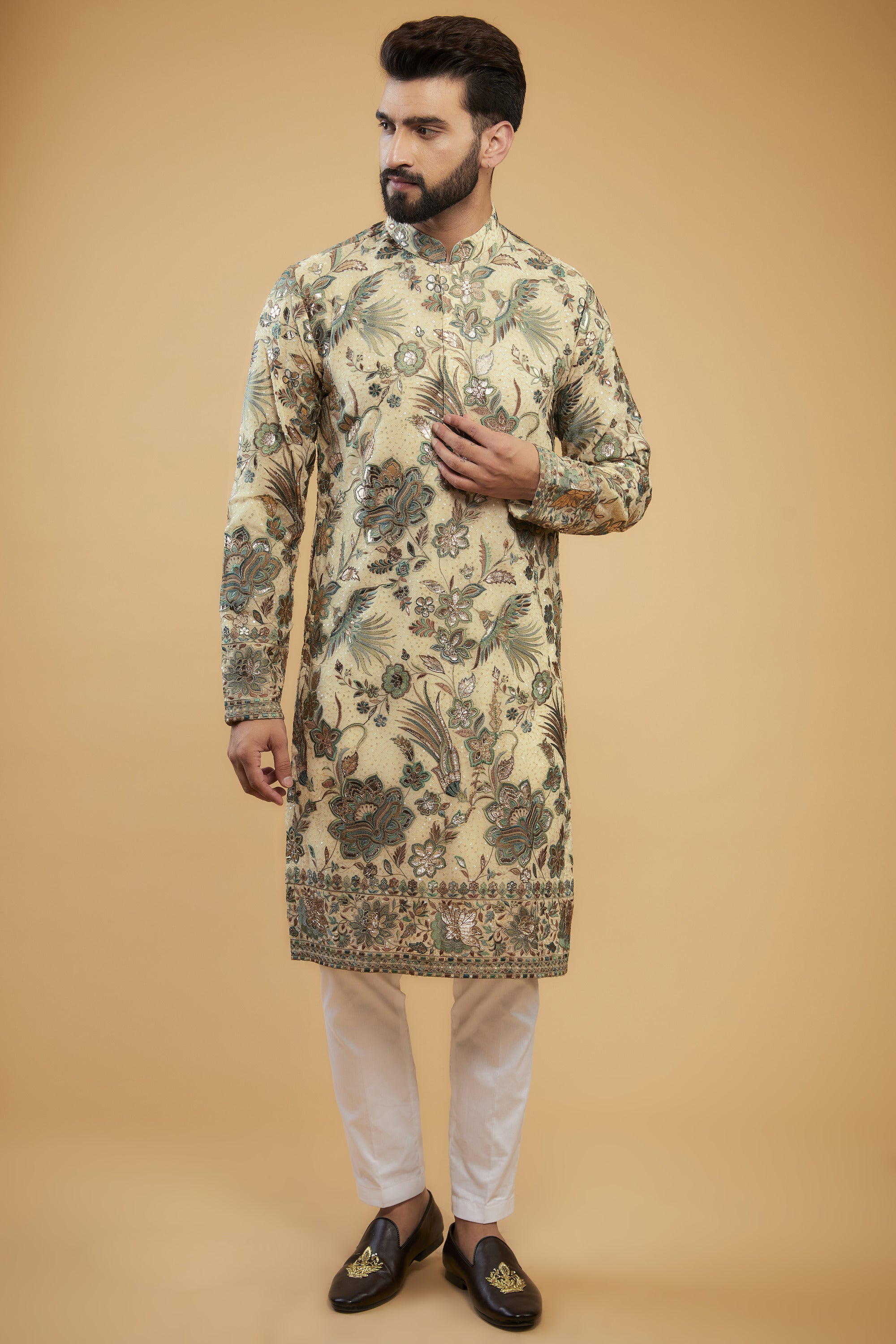 Cream Flora-Fauna Heavy embroidered kurta wuth intricate multi-threadwork in hues of green and gold leather patchwork - kasbahmen