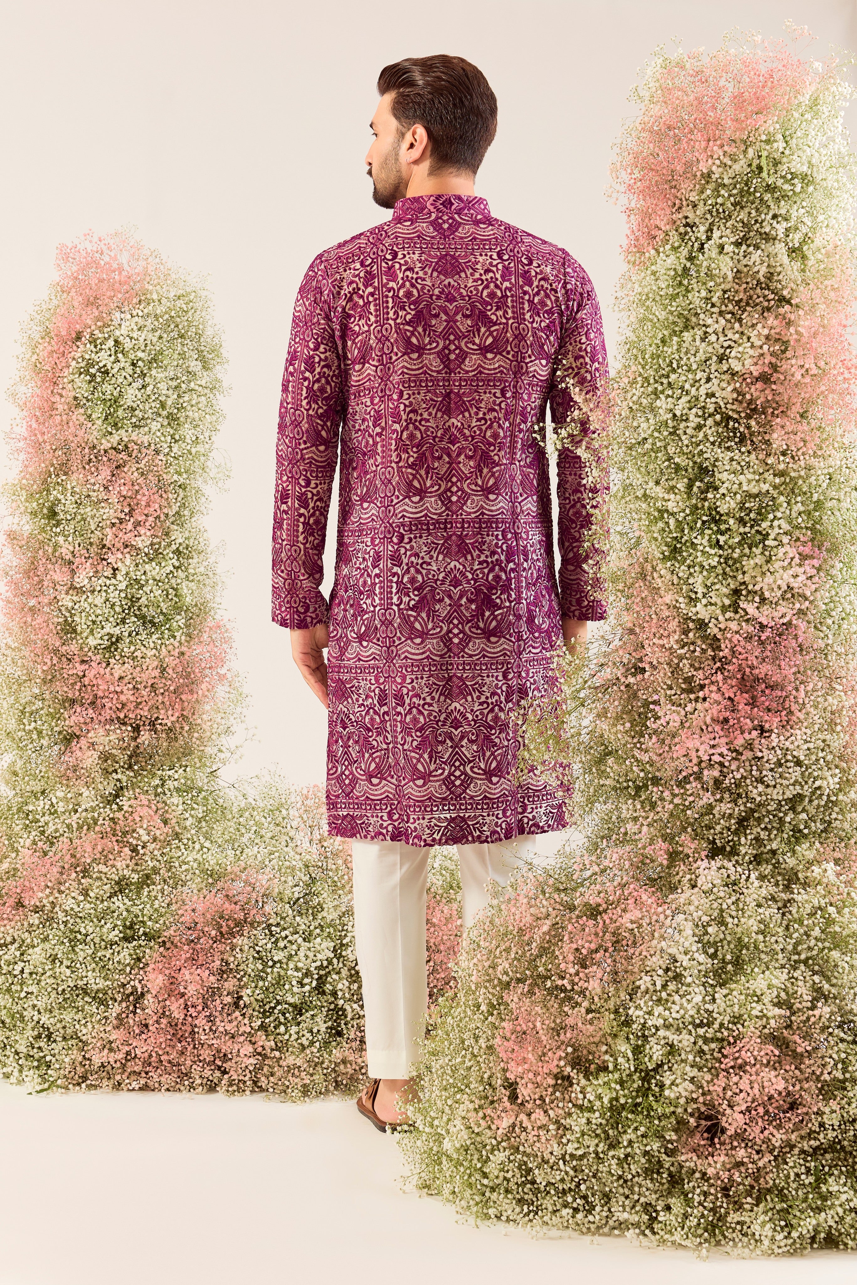 Radiate pure elegance in this magenta long kurta. The see through, intricate Chikankari work tells a story of tradition and grace, creating a look that's both captivating and timeless. It's the perfect blend of modern allure and classic artistry.