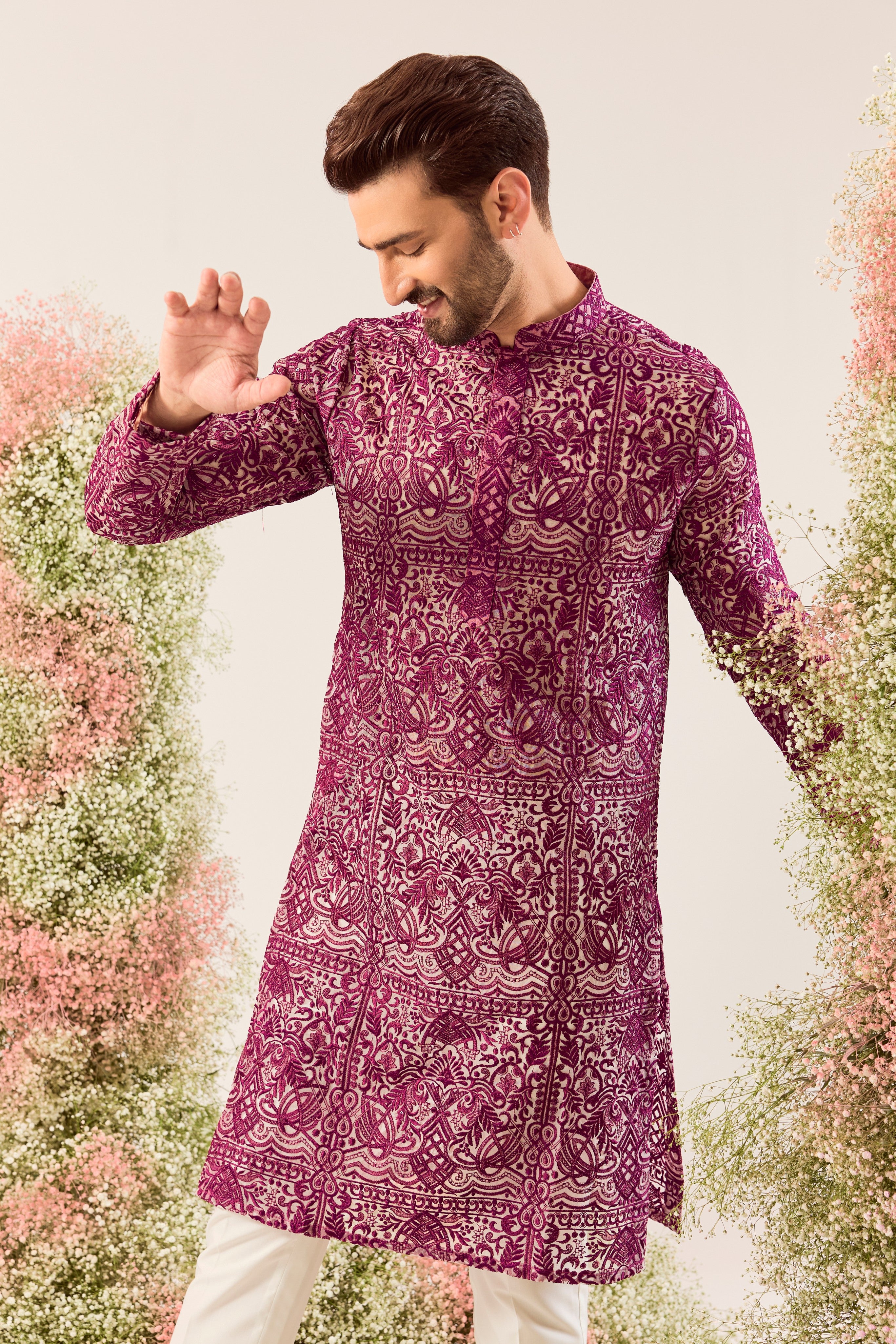 Radiate pure elegance in this magenta long kurta. The see through, intricate Chikankari work tells a story of tradition and grace, creating a look that's both captivating and timeless. It's the perfect blend of modern allure and classic artistry.