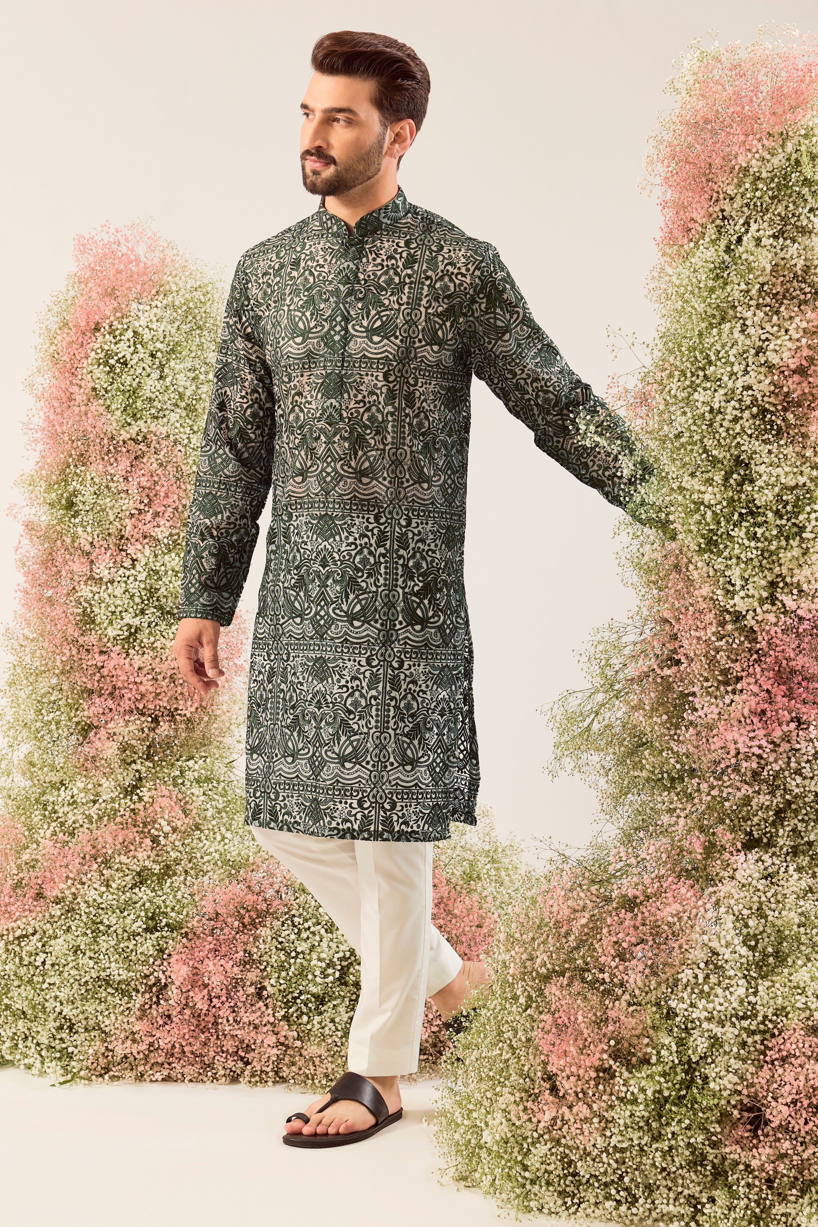 Radiate pure elegance in this emerald green long kurta. The see through, intricate Chikankari work tells a story of tradition and grace, creating a look that's both captivating and timeless. It's the perfect blend of modern allure and classic artistry.