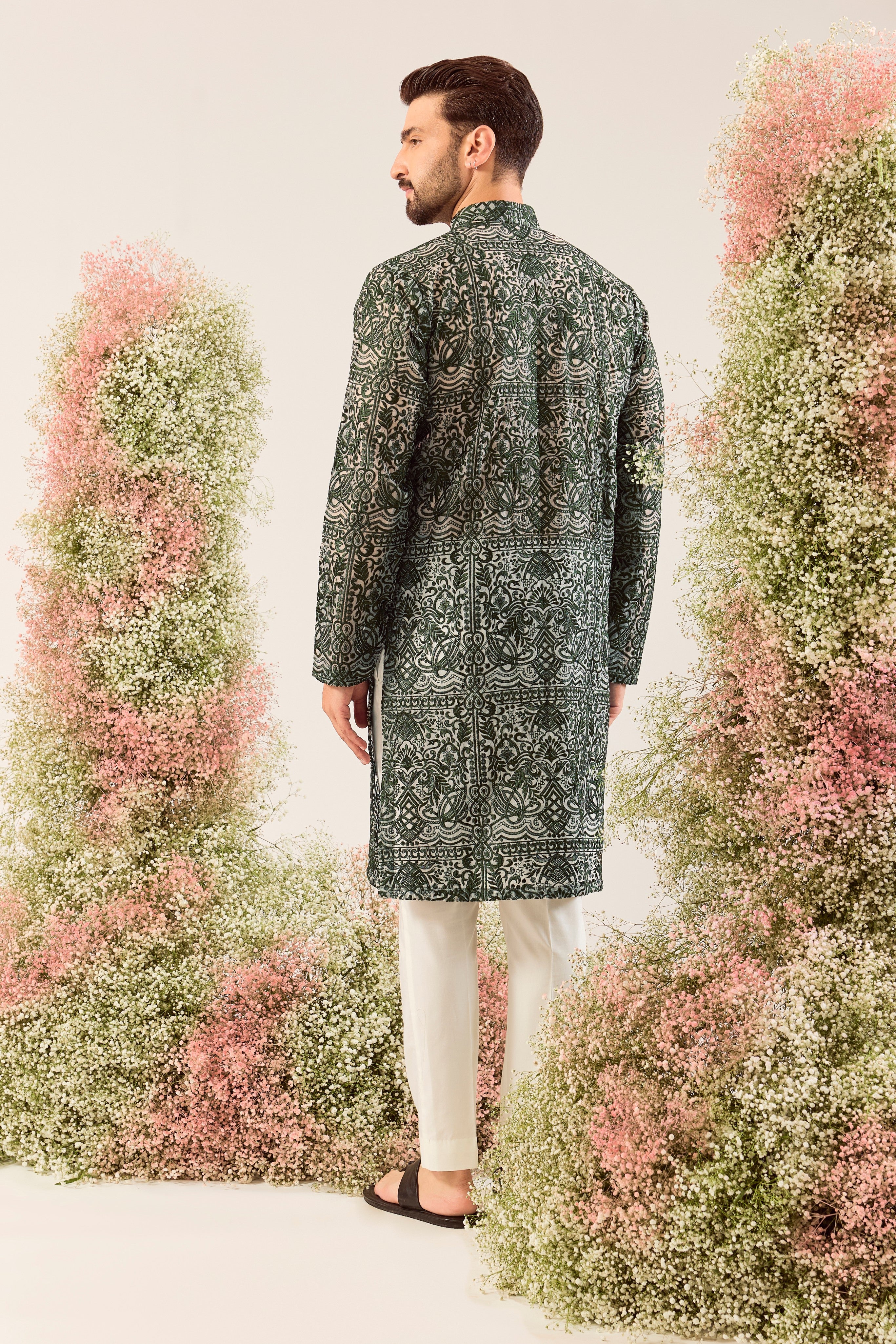 Radiate pure elegance in this emerald green long kurta. The see through, intricate Chikankari work tells a story of tradition and grace, creating a look that's both captivating and timeless. It's the perfect blend of modern allure and classic artistry.