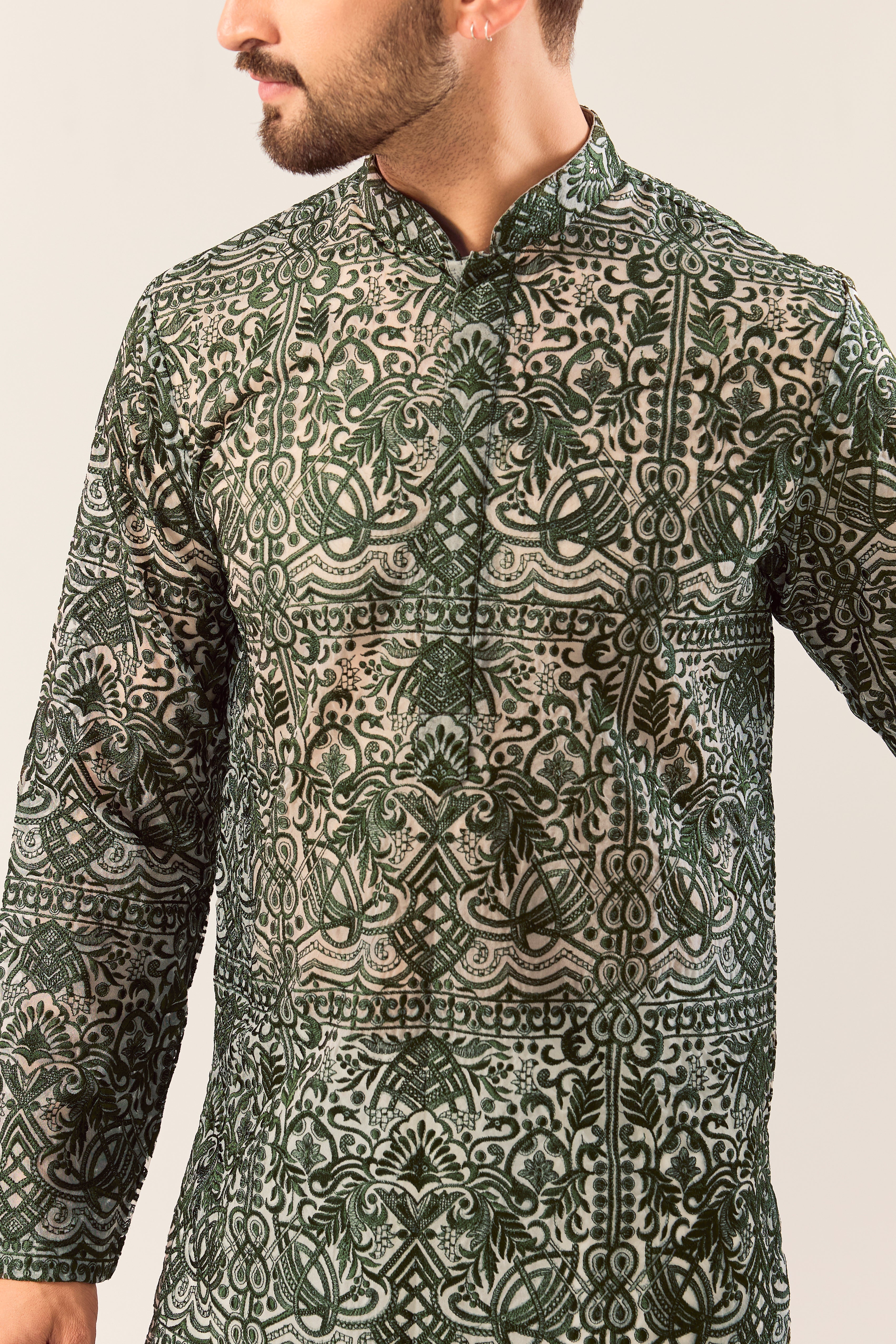 Radiate pure elegance in this emerald green long kurta. The see through, intricate Chikankari work tells a story of tradition and grace, creating a look that's both captivating and timeless. It's the perfect blend of modern allure and classic artistry.