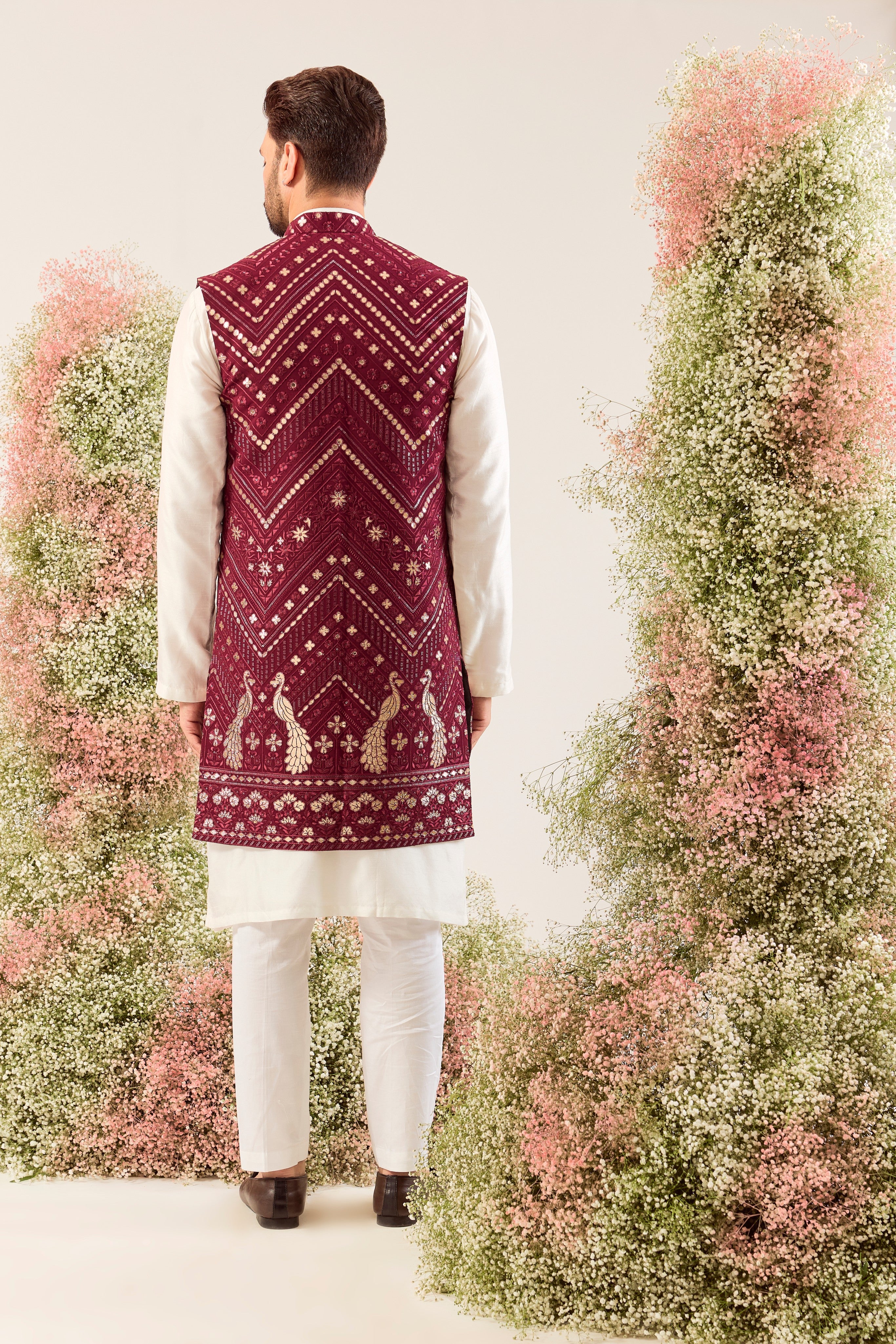 magenta long open jacket with detailed leather patchwork and peacock motifs