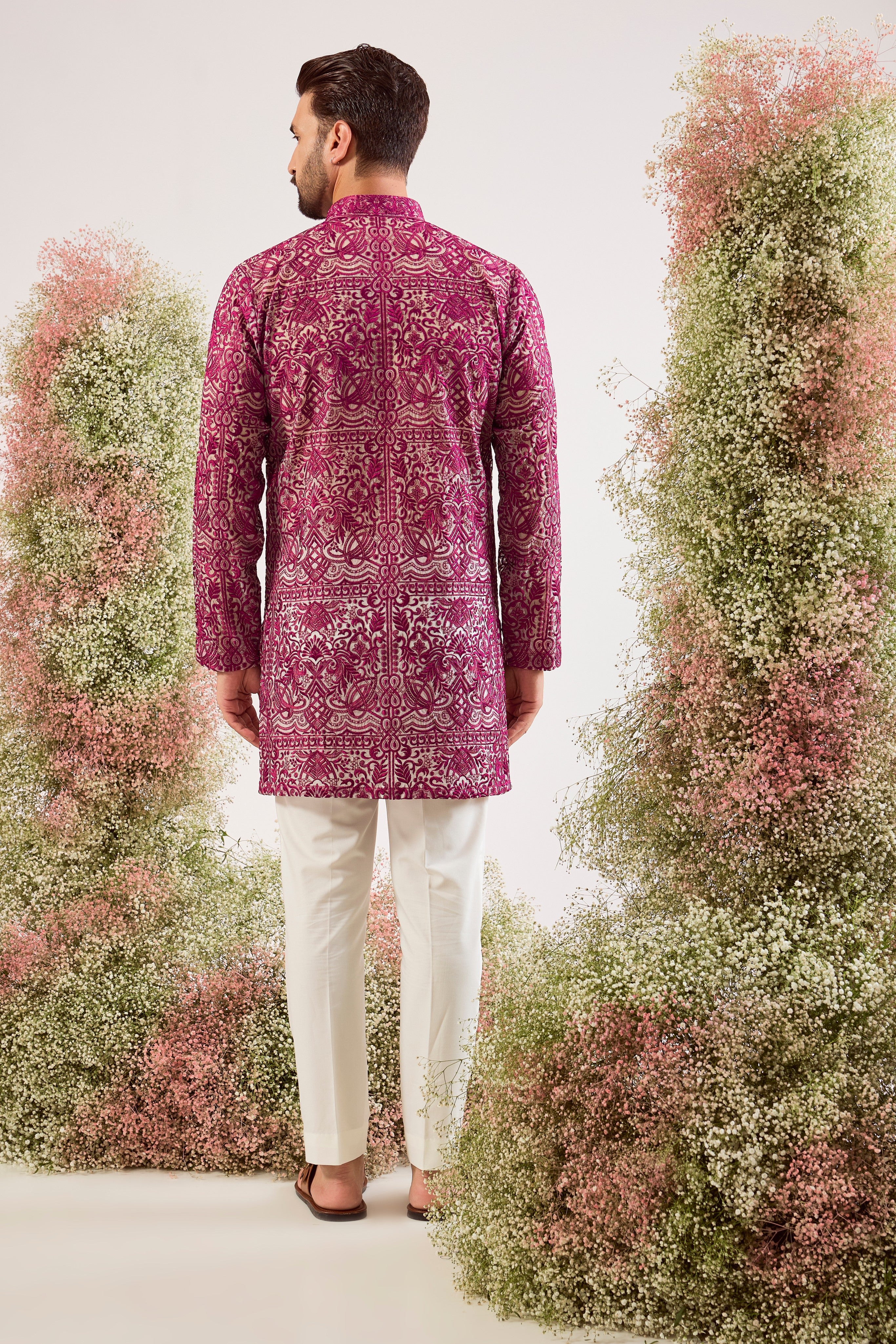 radiate elegance in this magenta open front see through short kurta