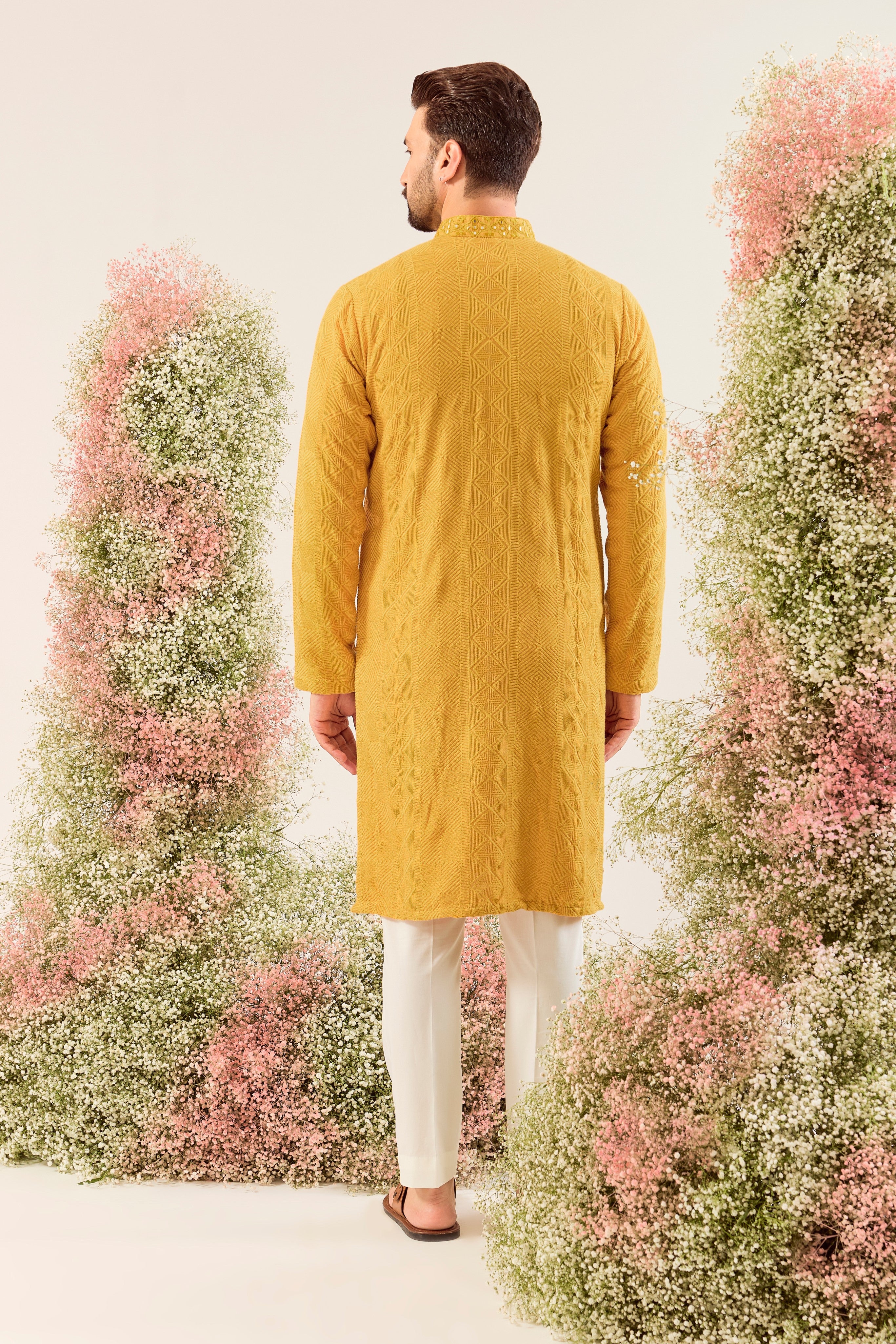 mustard chikankari kurta with intricately hand done mirror work neckline
