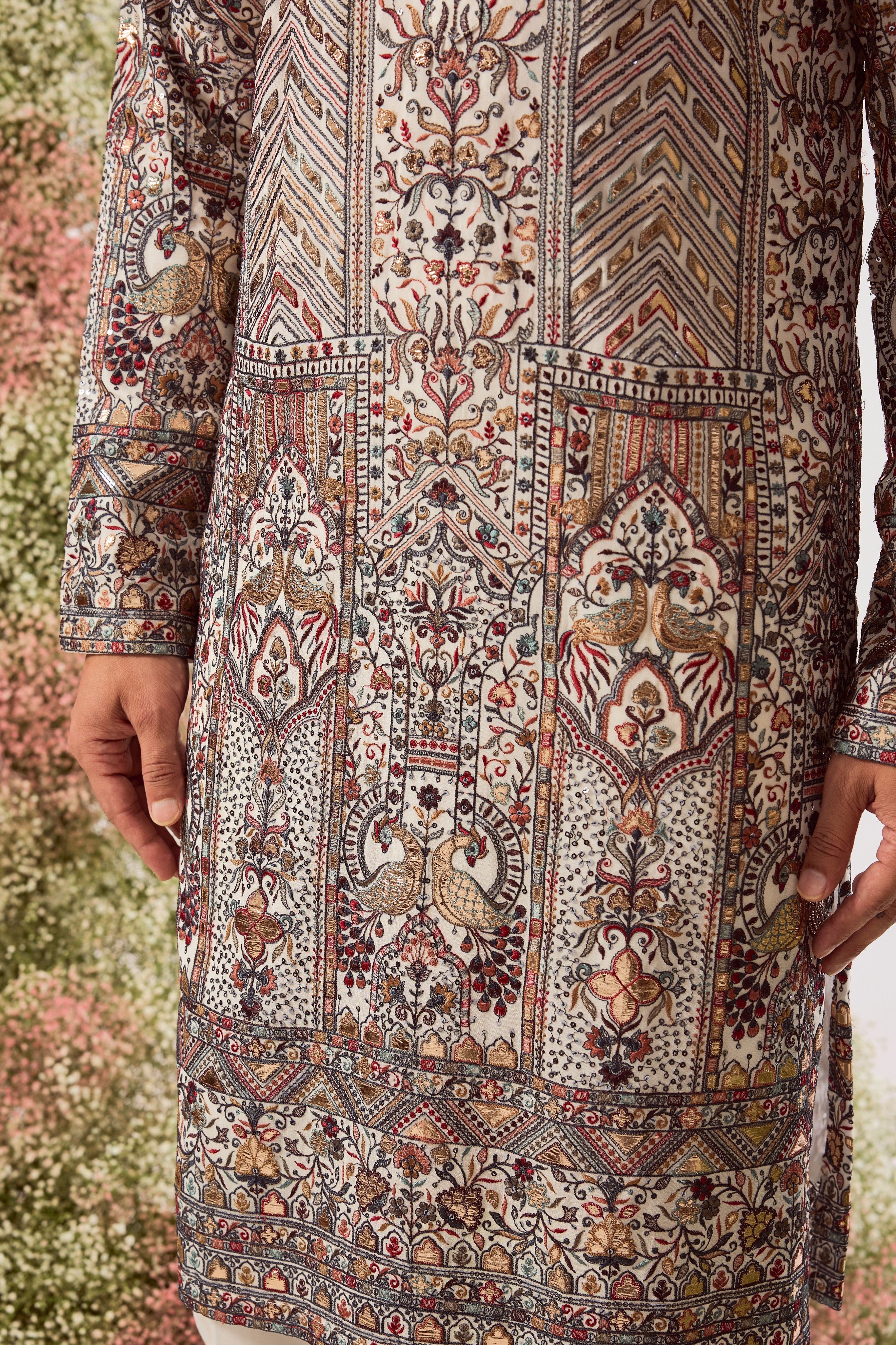 white leather patchwork kurta with intricate flora and fauna embroidery