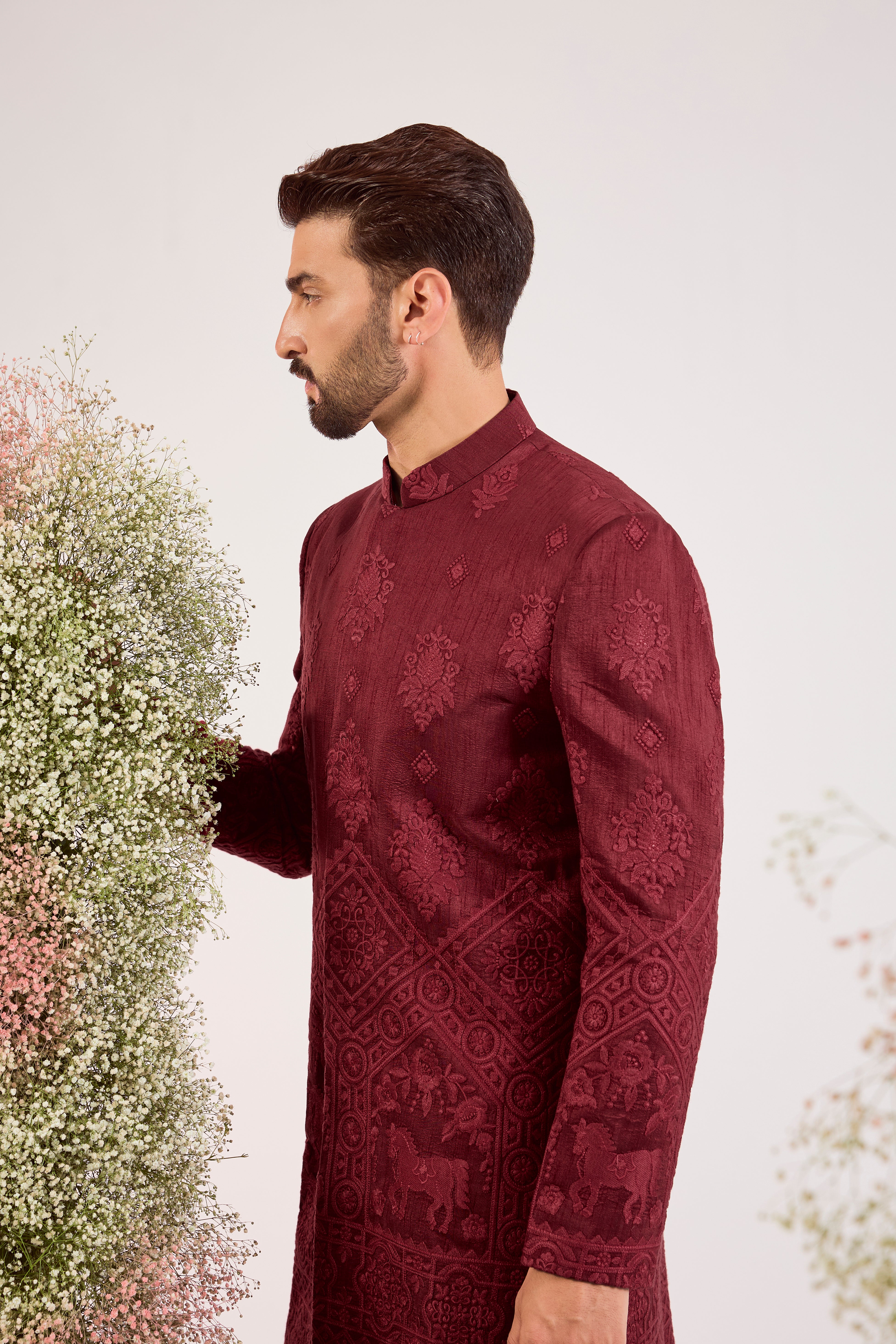 maroon short chikankari sherwani with intricate horse figures and tone to tone threadwork