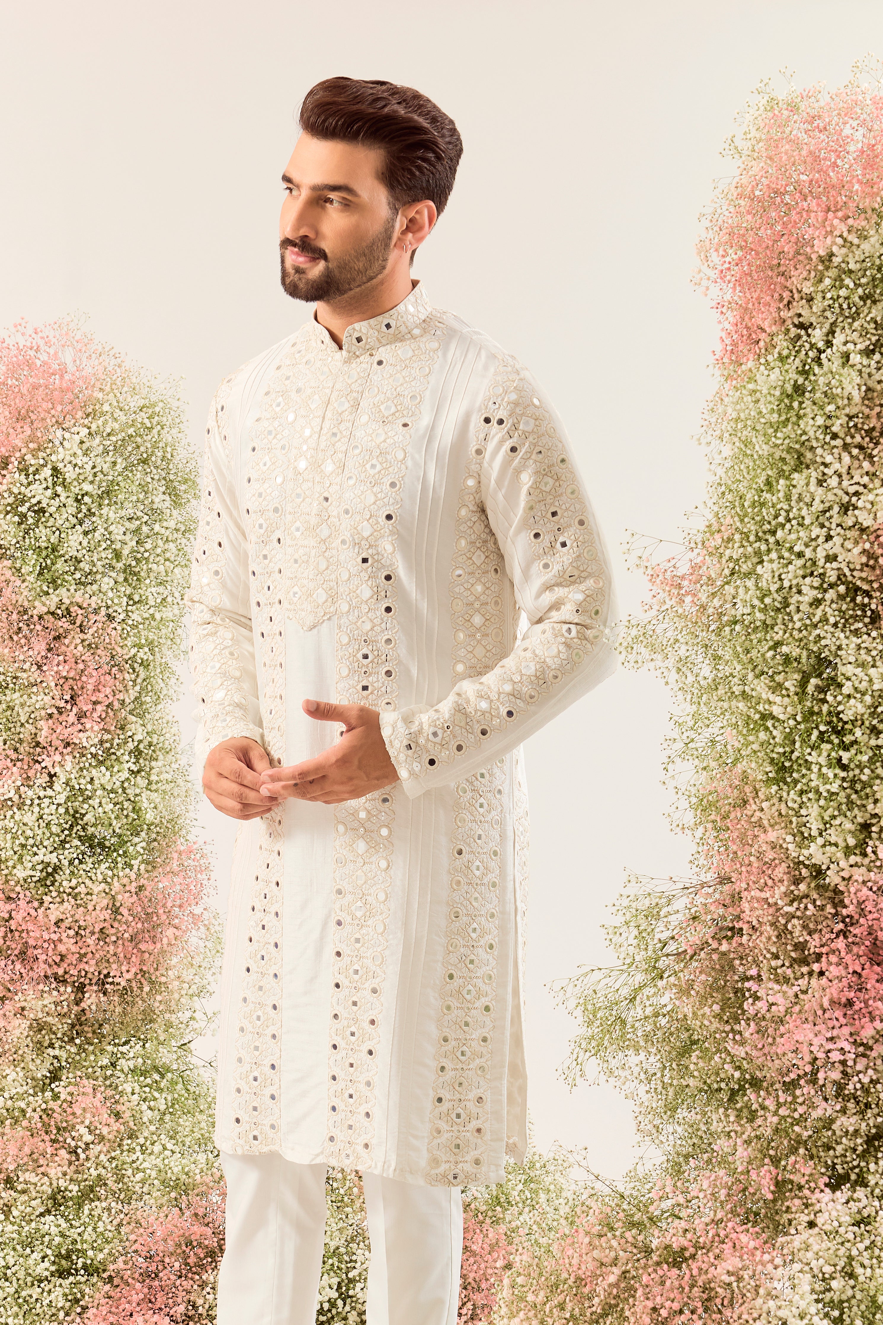 white mirror work kurta with deatiled pintucks and neckline