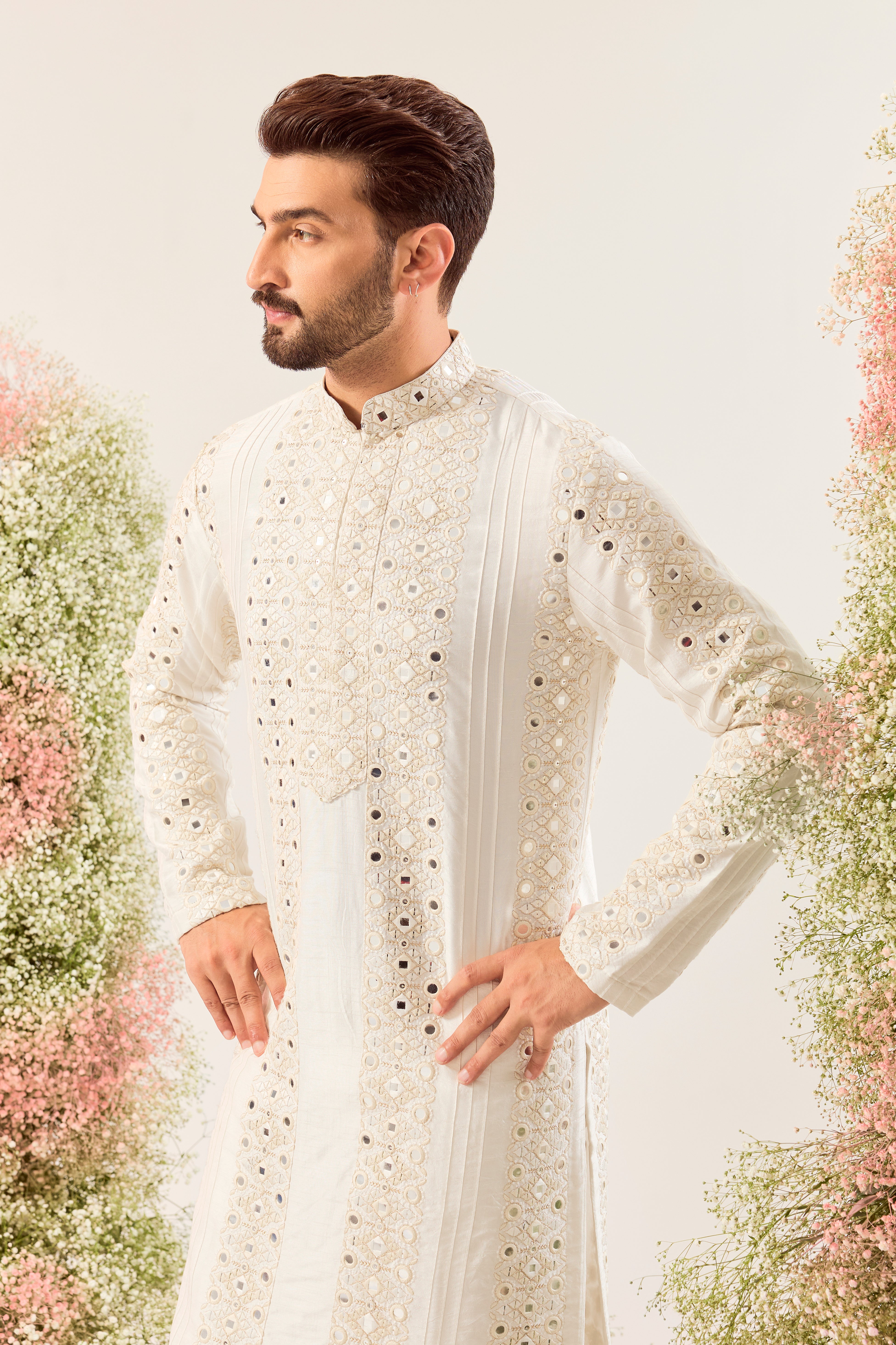 white mirror work kurta with deatiled pintucks and neckline