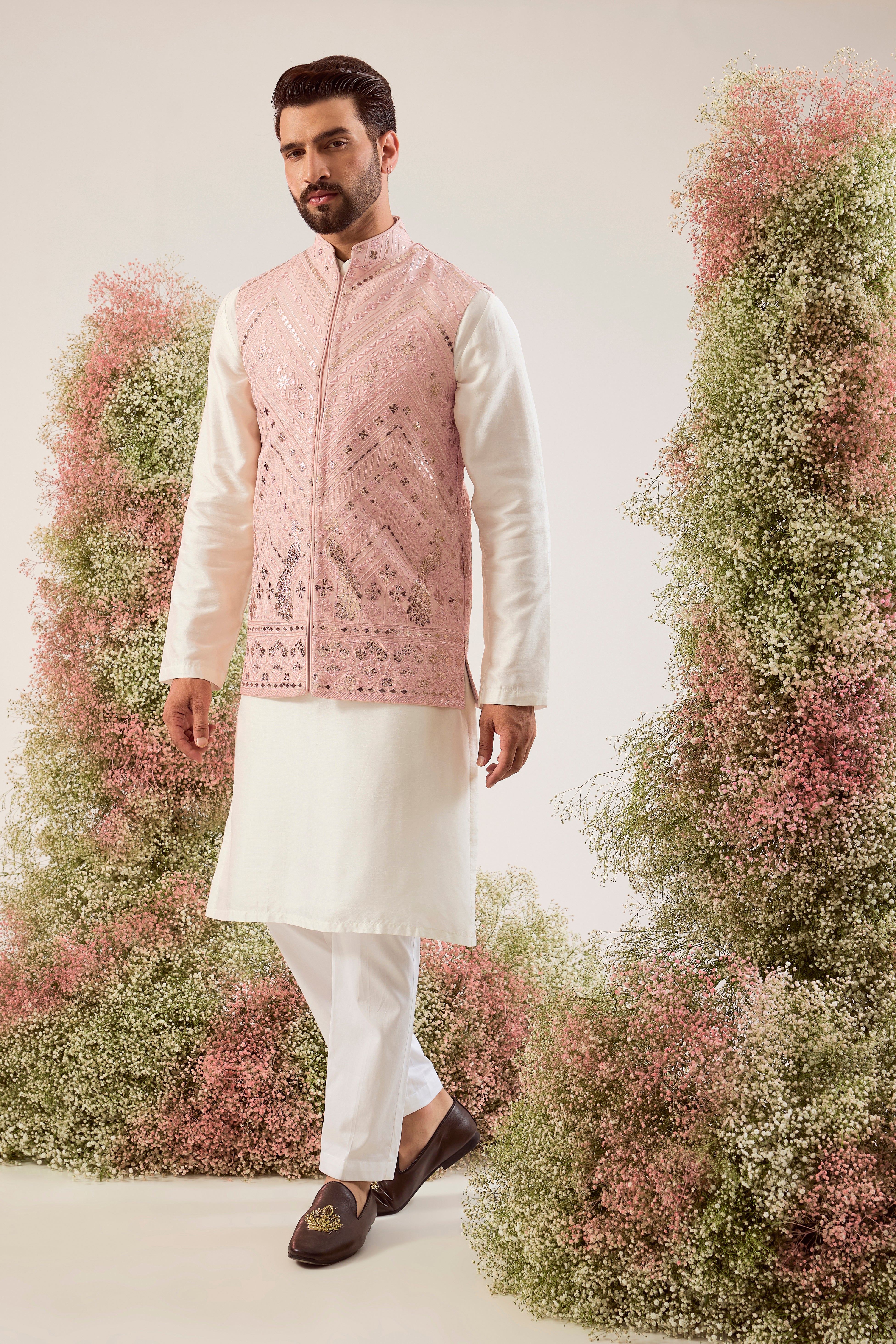 peach leather patchwork jacket with intricate peacock motifs