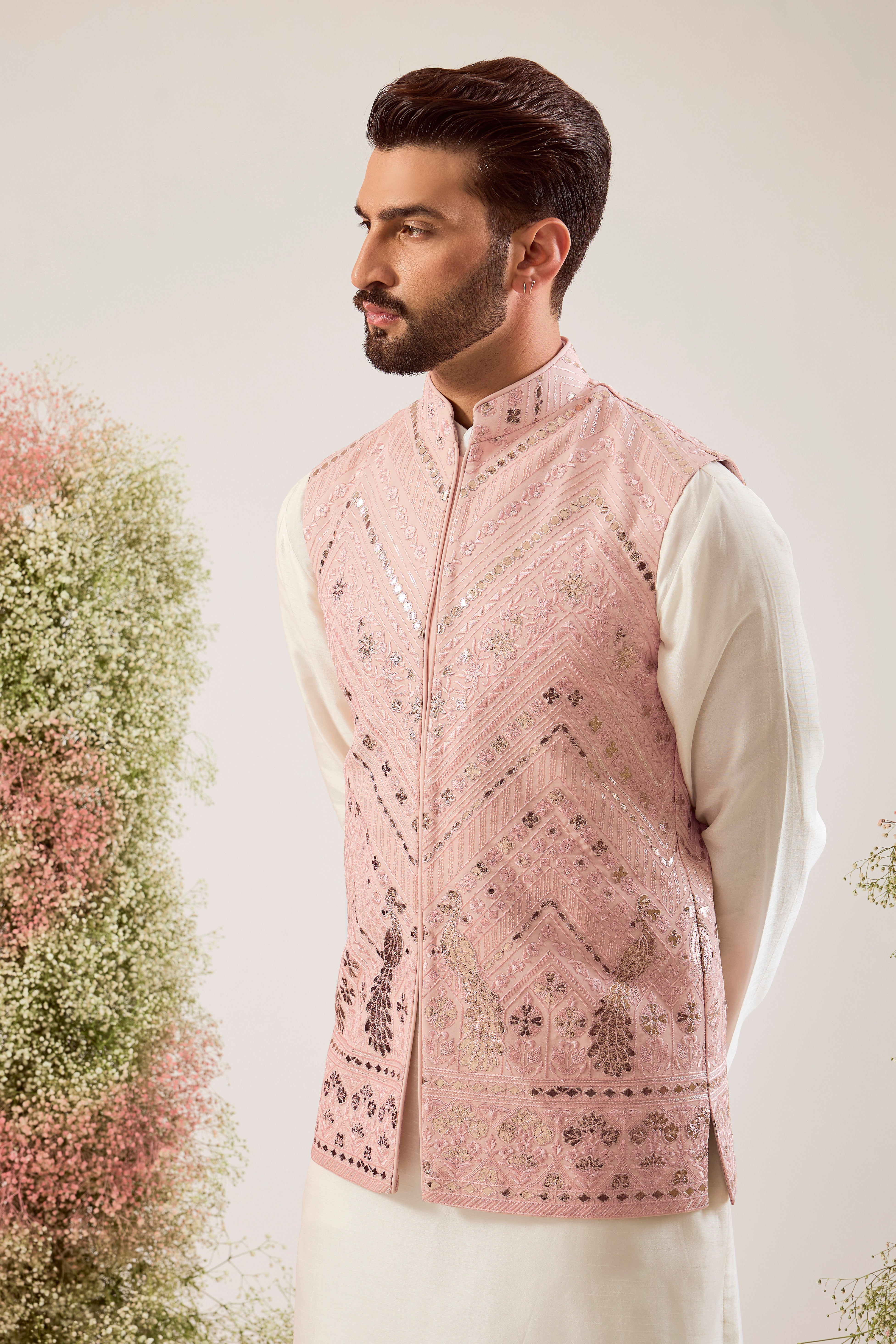 peach leather patchwork jacket with intricate peacock motifs
