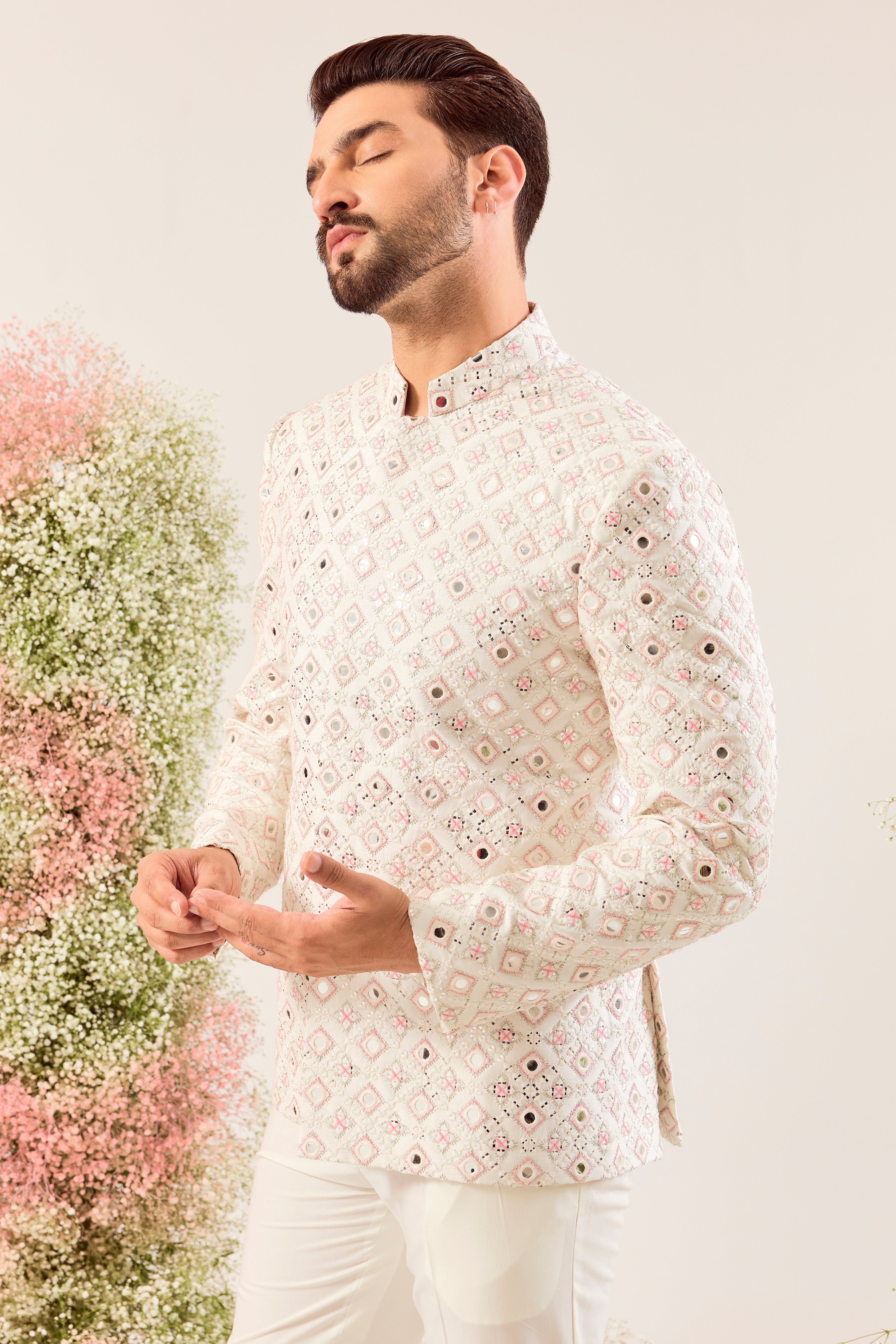 our signature white mirror work bandgala with intricate peach thread work and sequin details