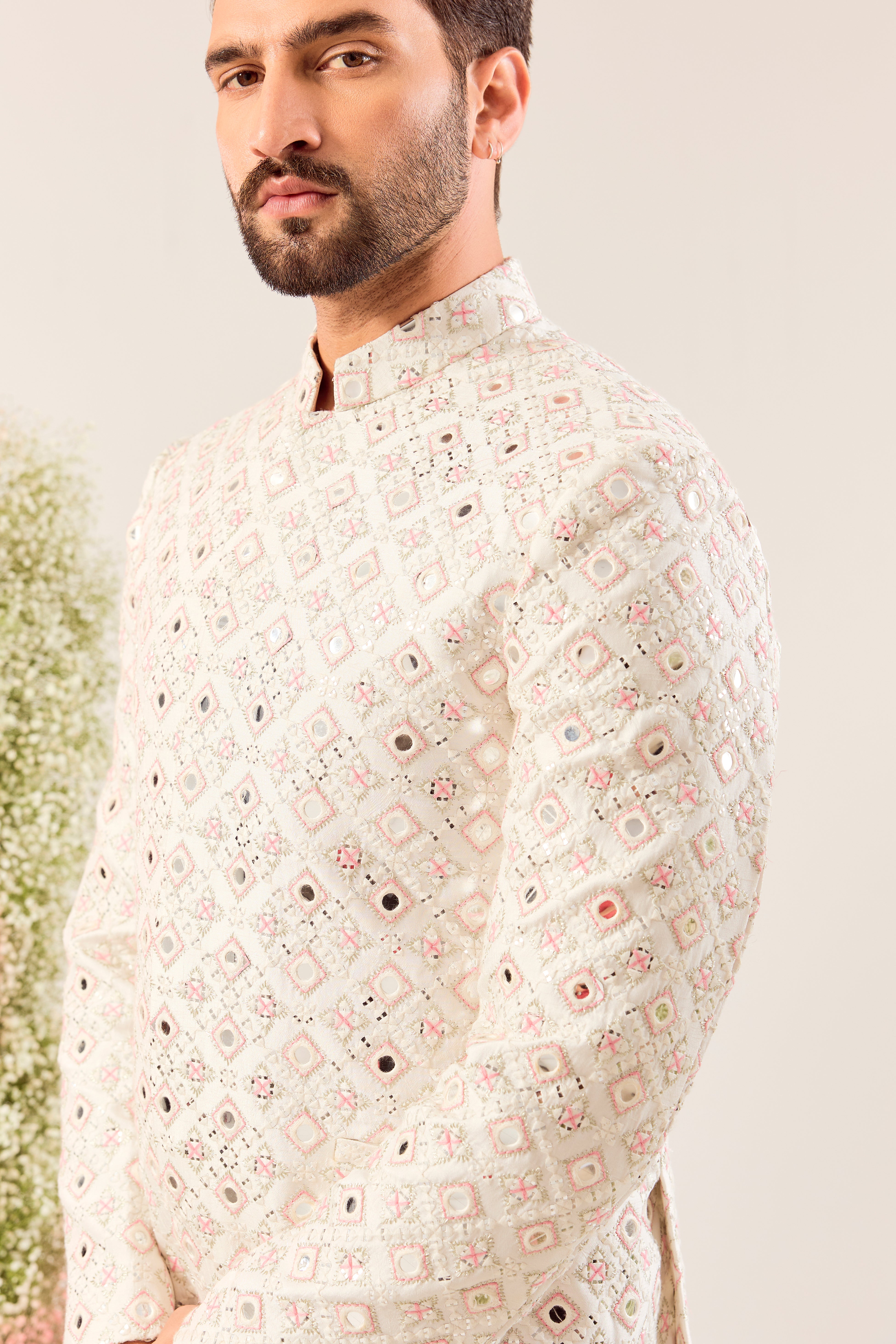 our signature white mirror work bandgala with intricate peach thread work and sequin details