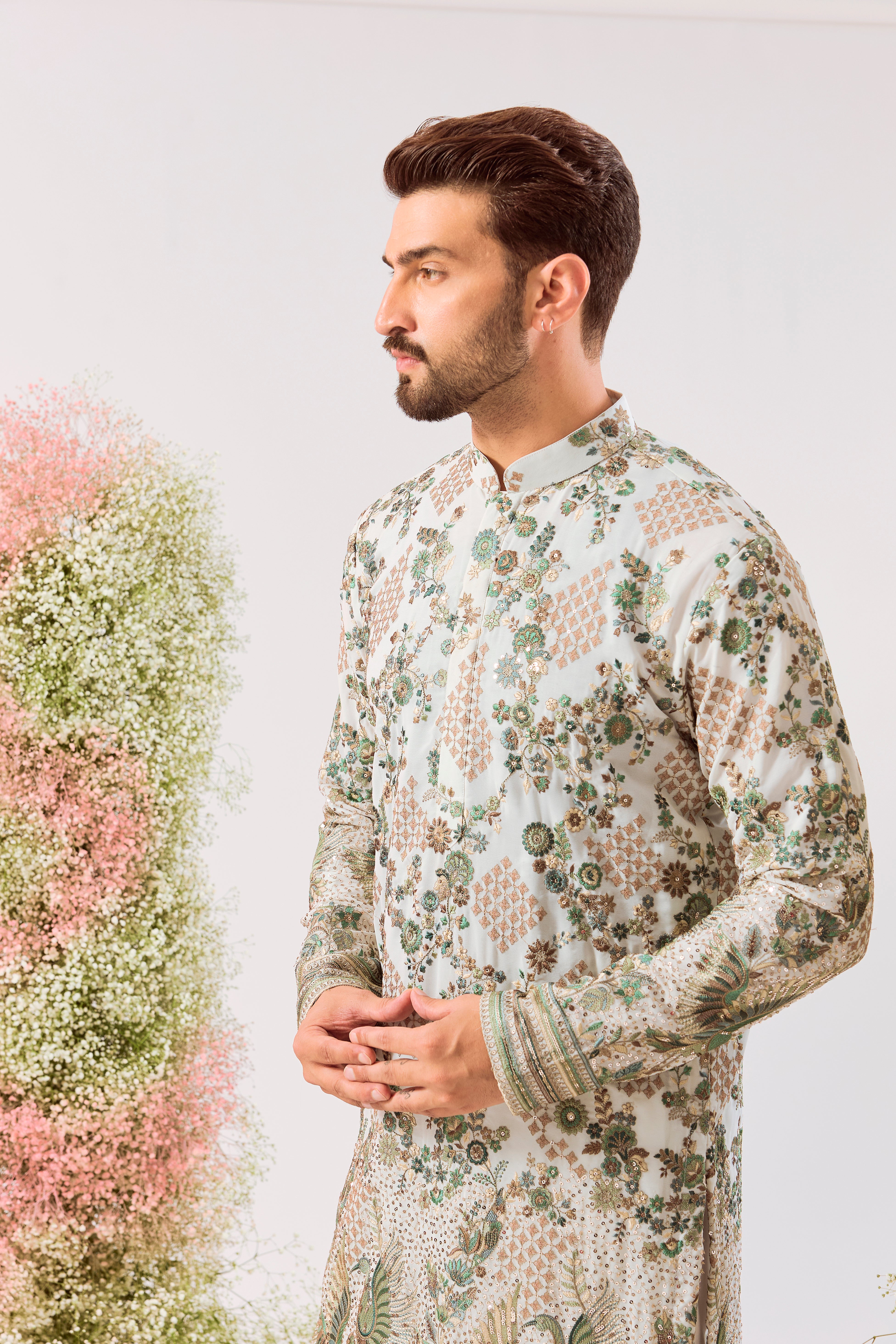 white sequined kurta with intricate flora and fauna embroidery