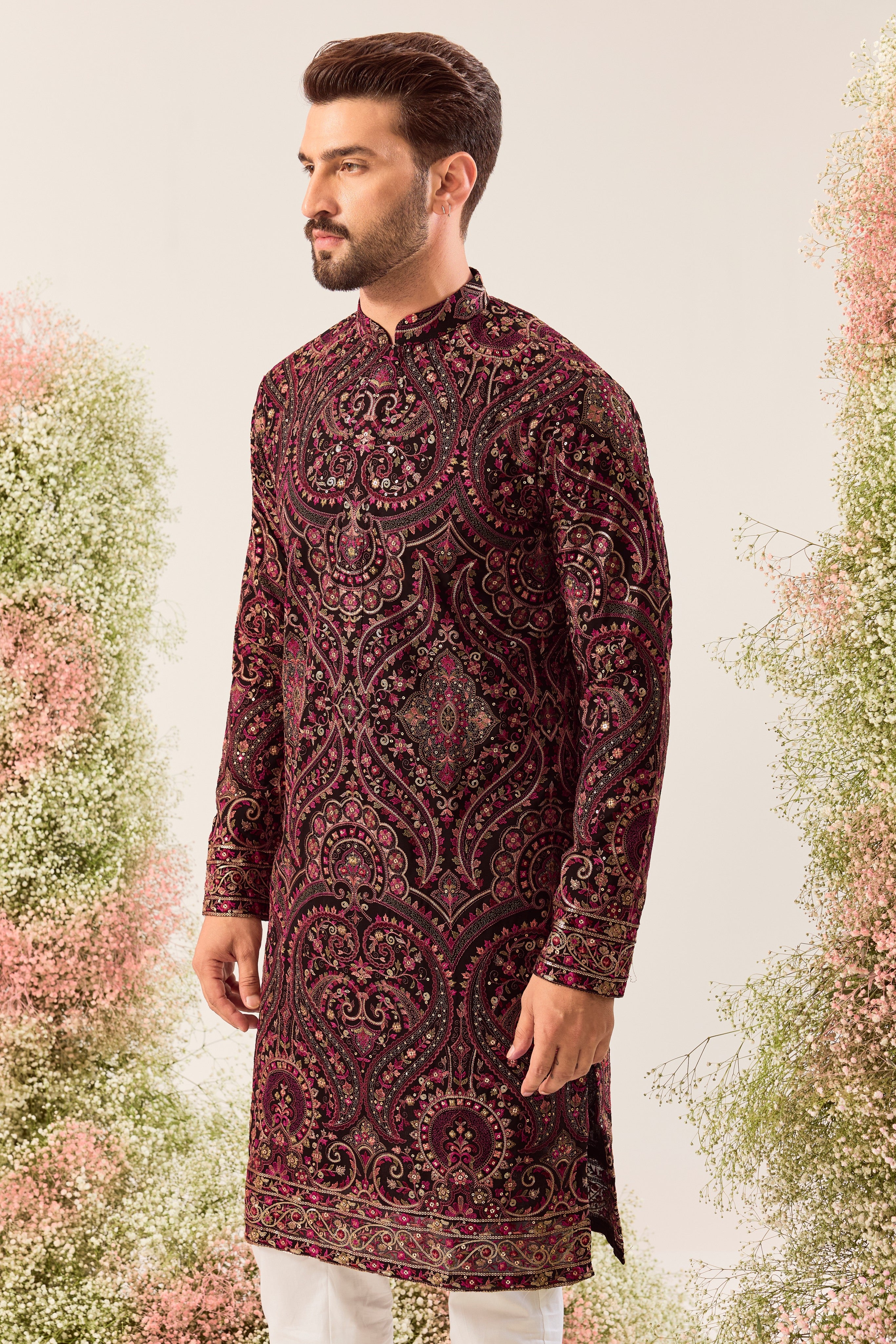 This elegant black Kashmiri chikankari kurta is a masterpiece of traditional artistry.