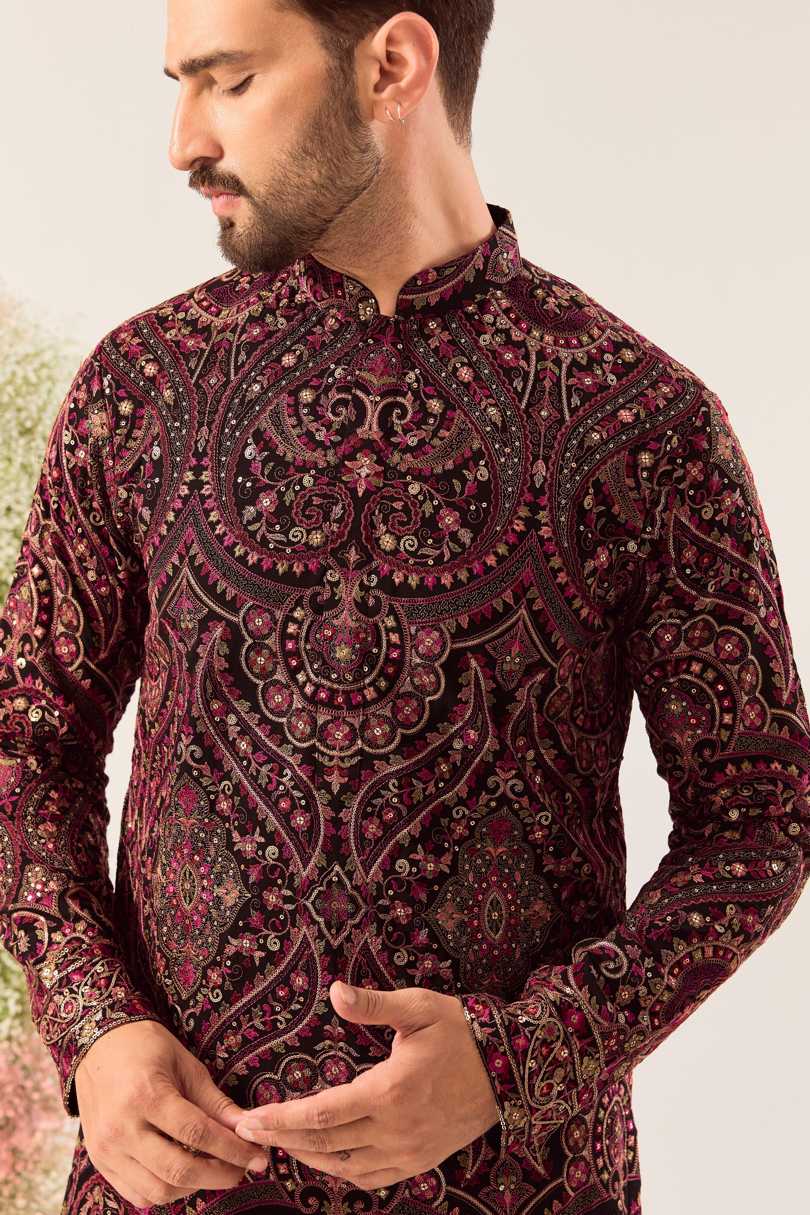 This elegant black Kashmiri chikankari kurta is a masterpiece of traditional artistry.
