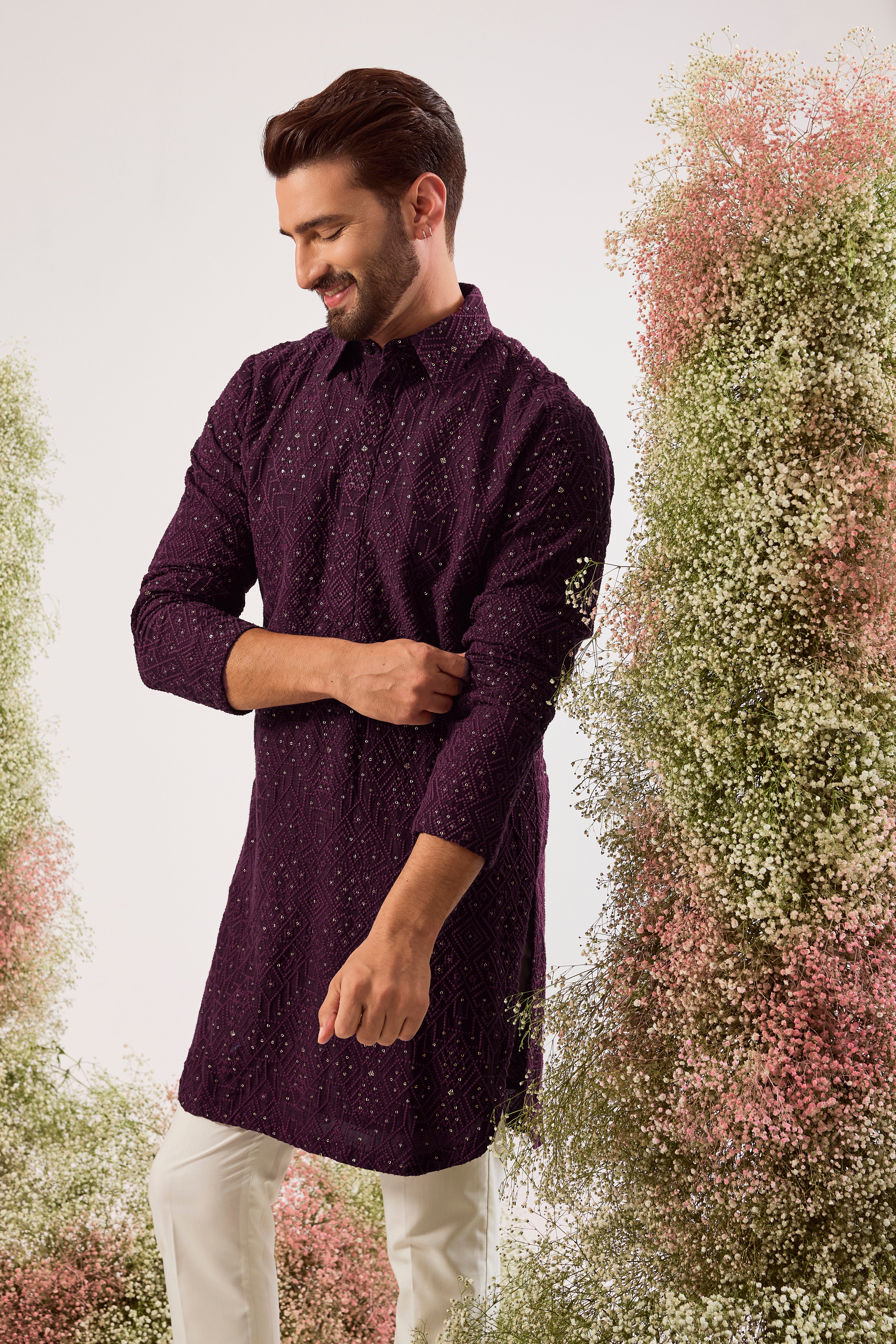 This elegant wine geometrically embroidered short pathani kurta is a masterpiece of modern design.