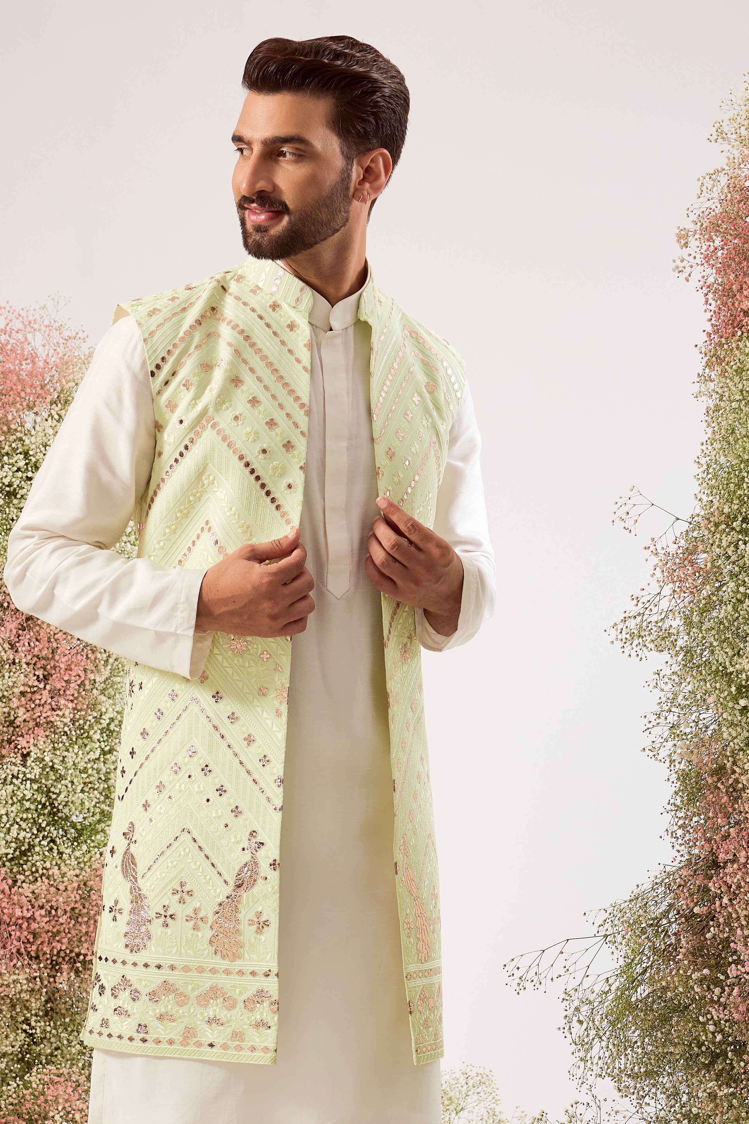 This magnificent green leather patchwork long open jacket is a true masterpiece of modern artistry.