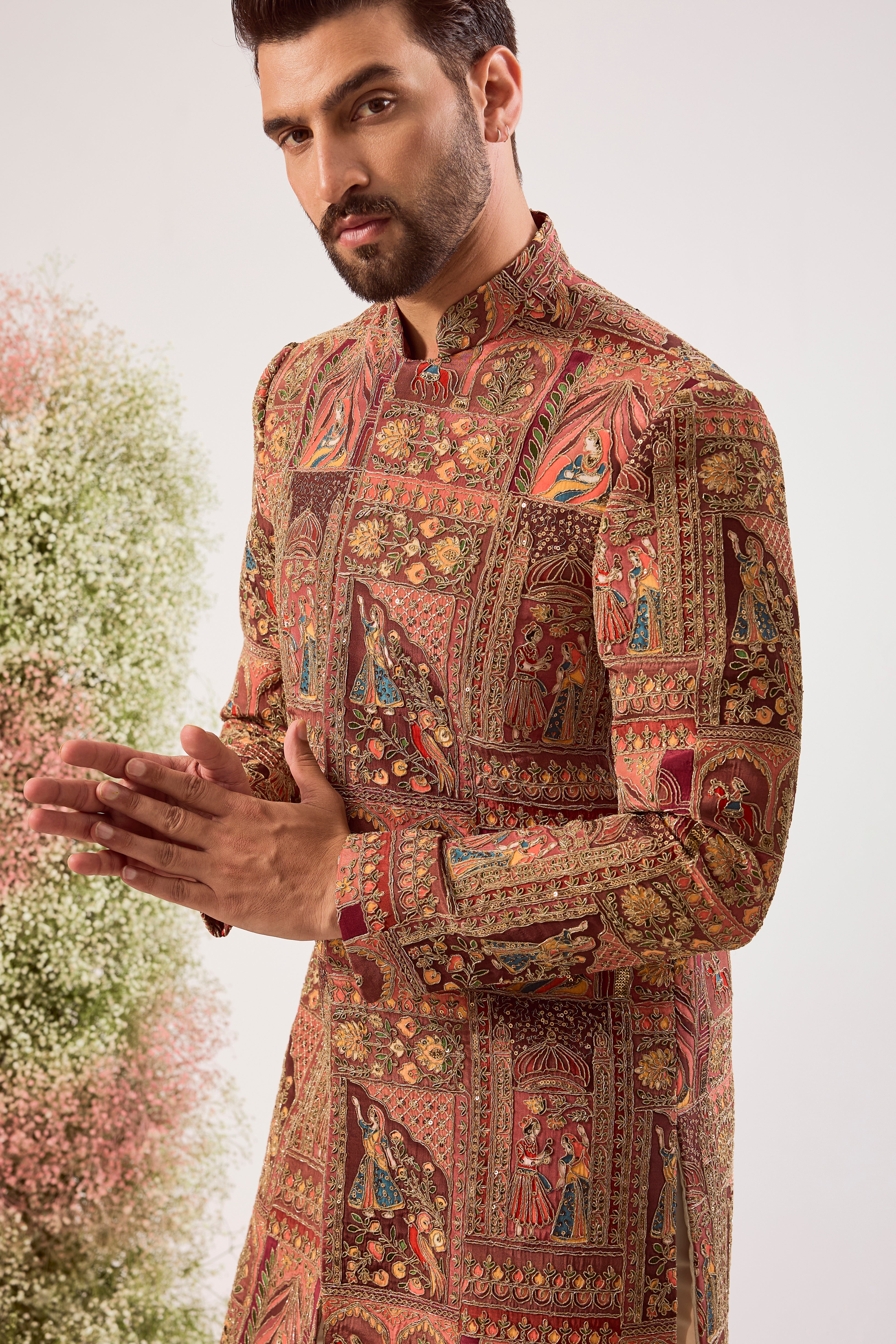 This magnificent mauve royal heritage short sherwani is a true masterpiece of traditional artistry and modern elegance