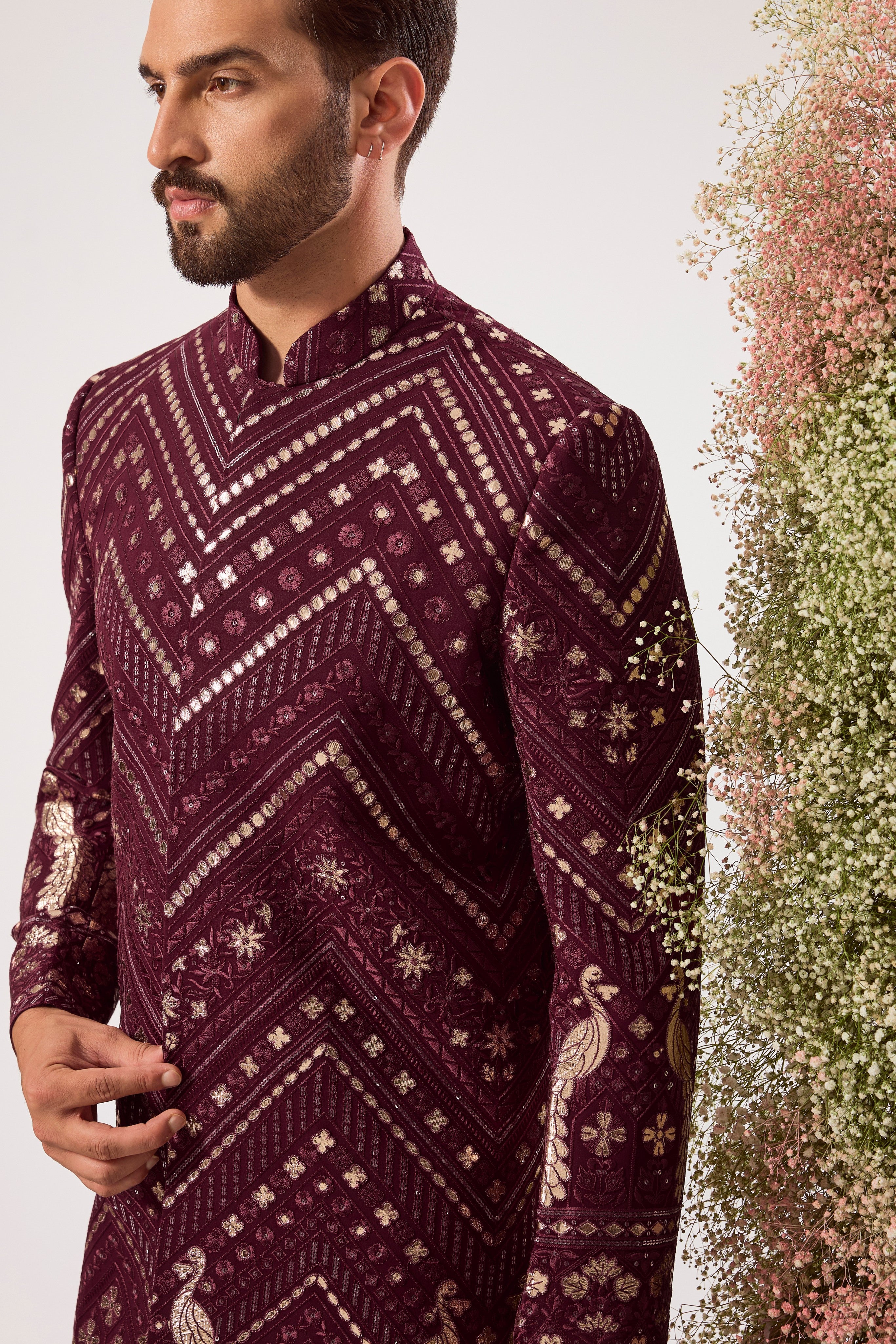 This majestic magenta short Indo-western is a true work of art, designed for the man who dares to be different.