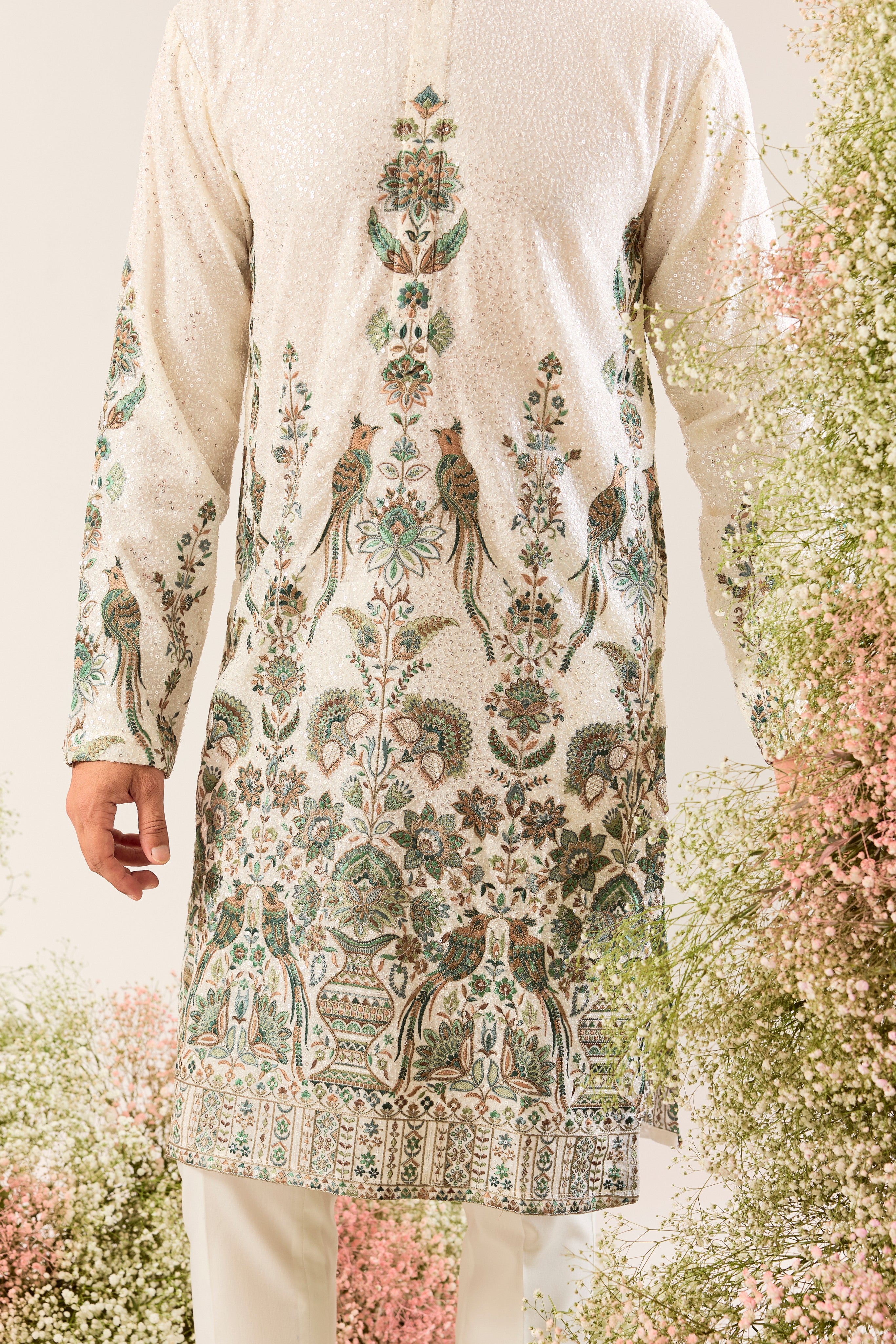 This exquisite white sequined kurta is a true masterpiece of refined artistry.
