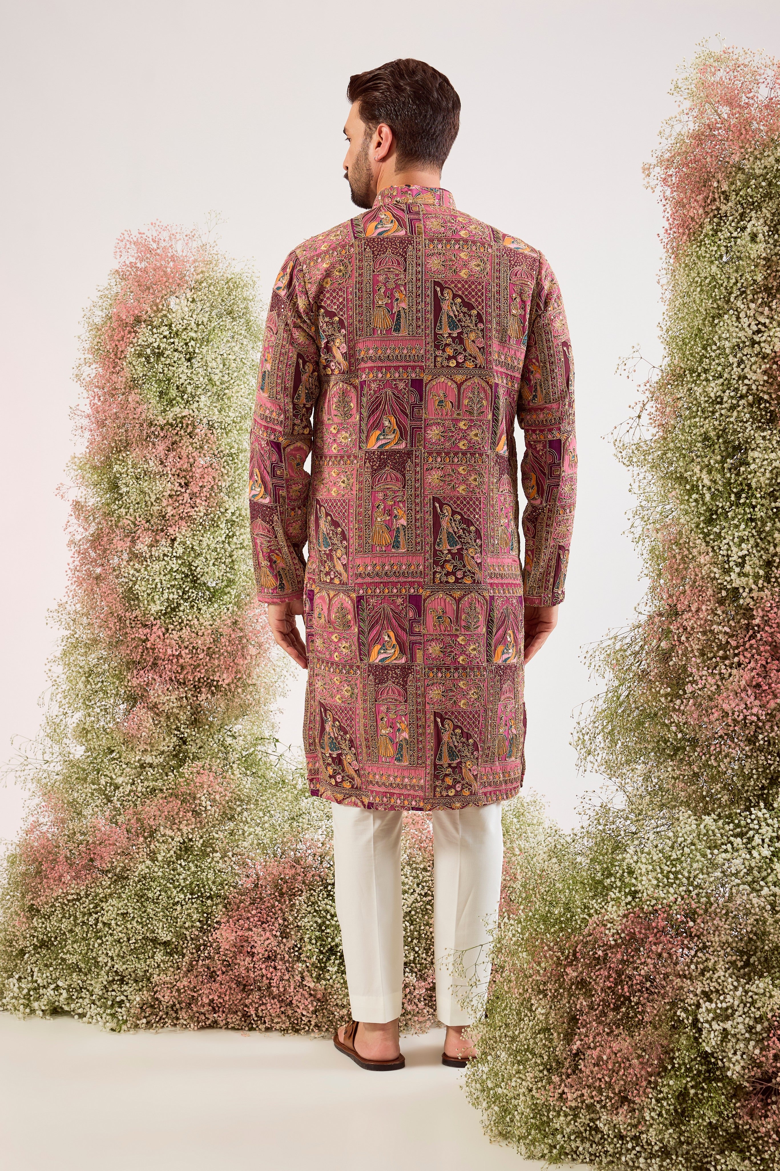This regal purple royal heritage kurta is a true masterpiece of traditional artistry.