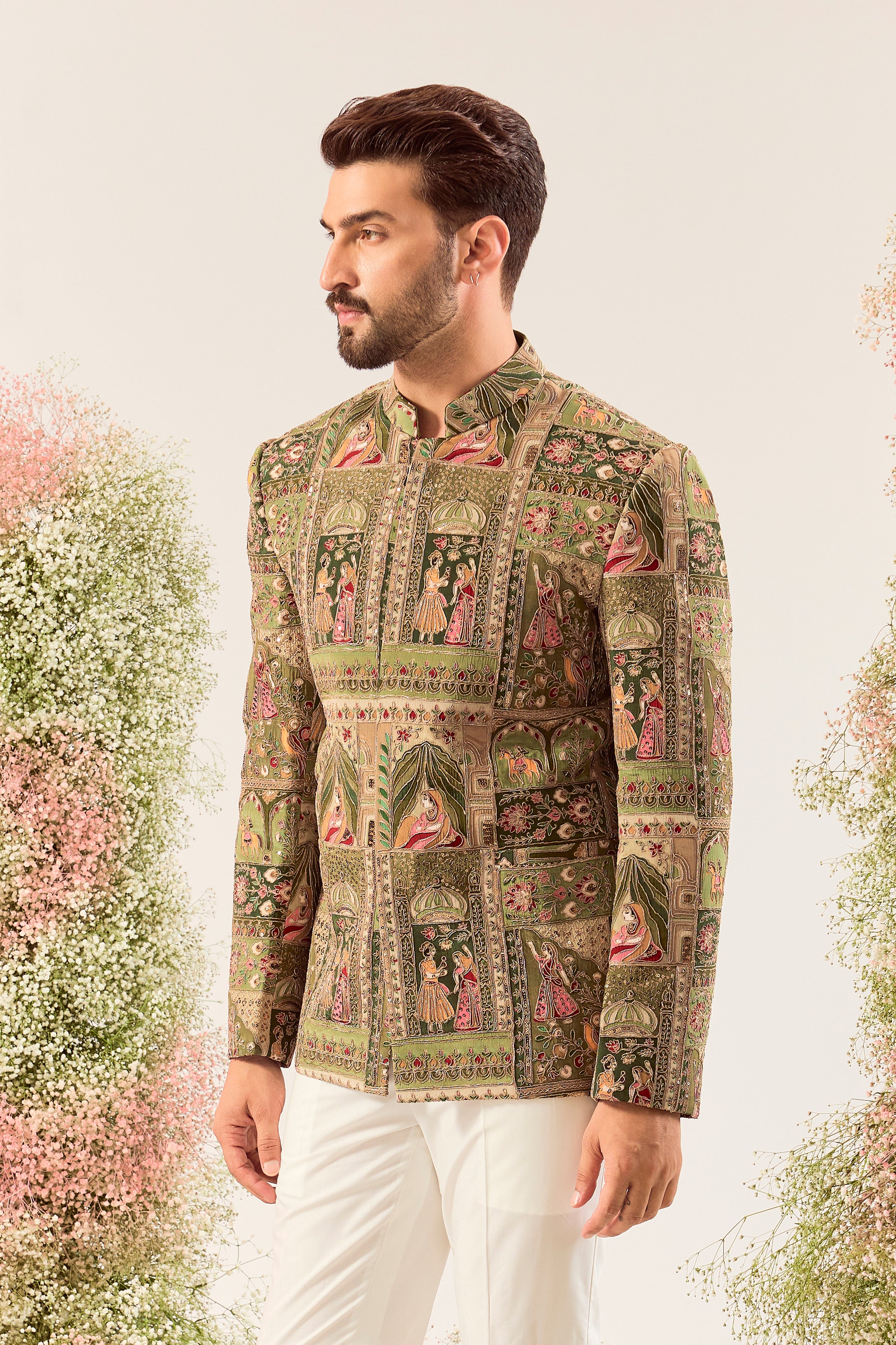 This striking green royal heritage bandhgala is a masterpiece of traditional artistry.