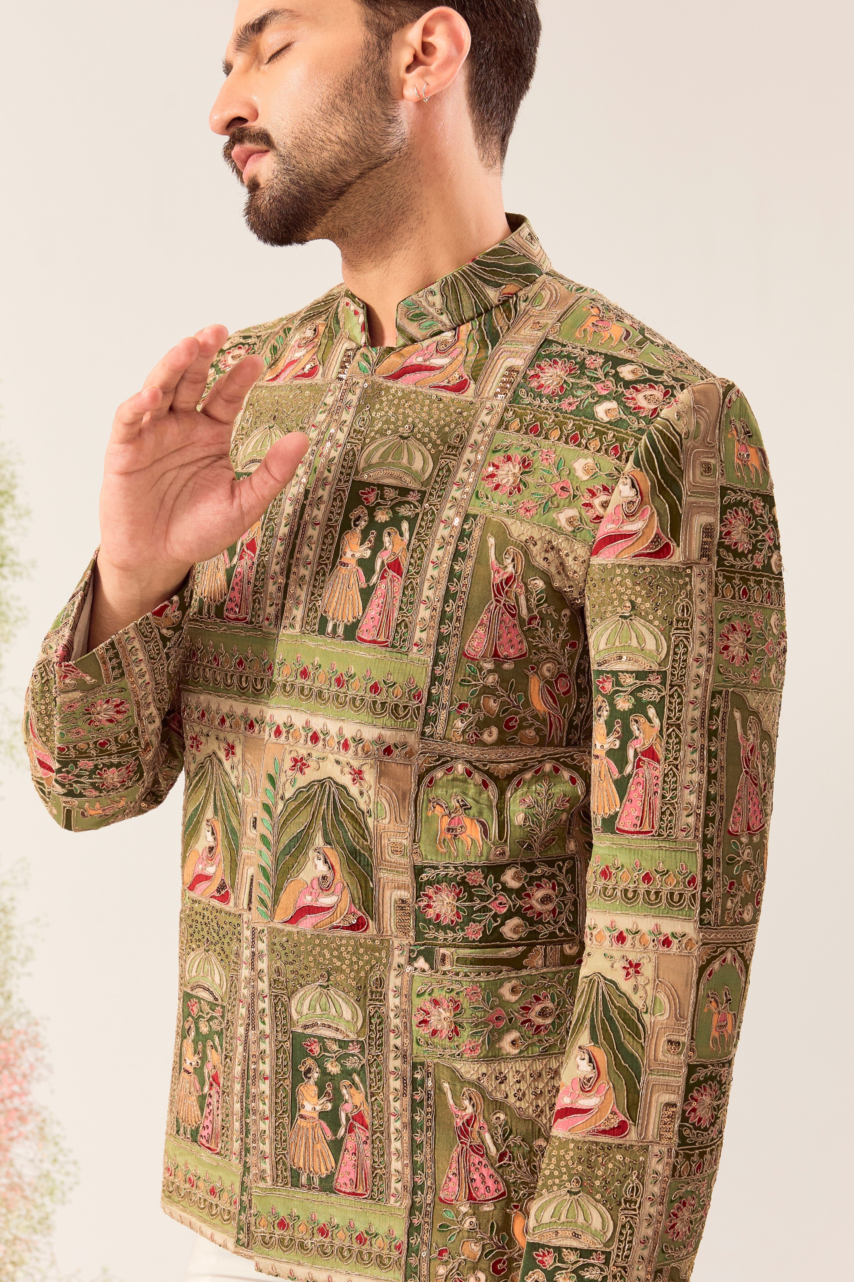 This striking green royal heritage bandhgala is a masterpiece of traditional artistry.