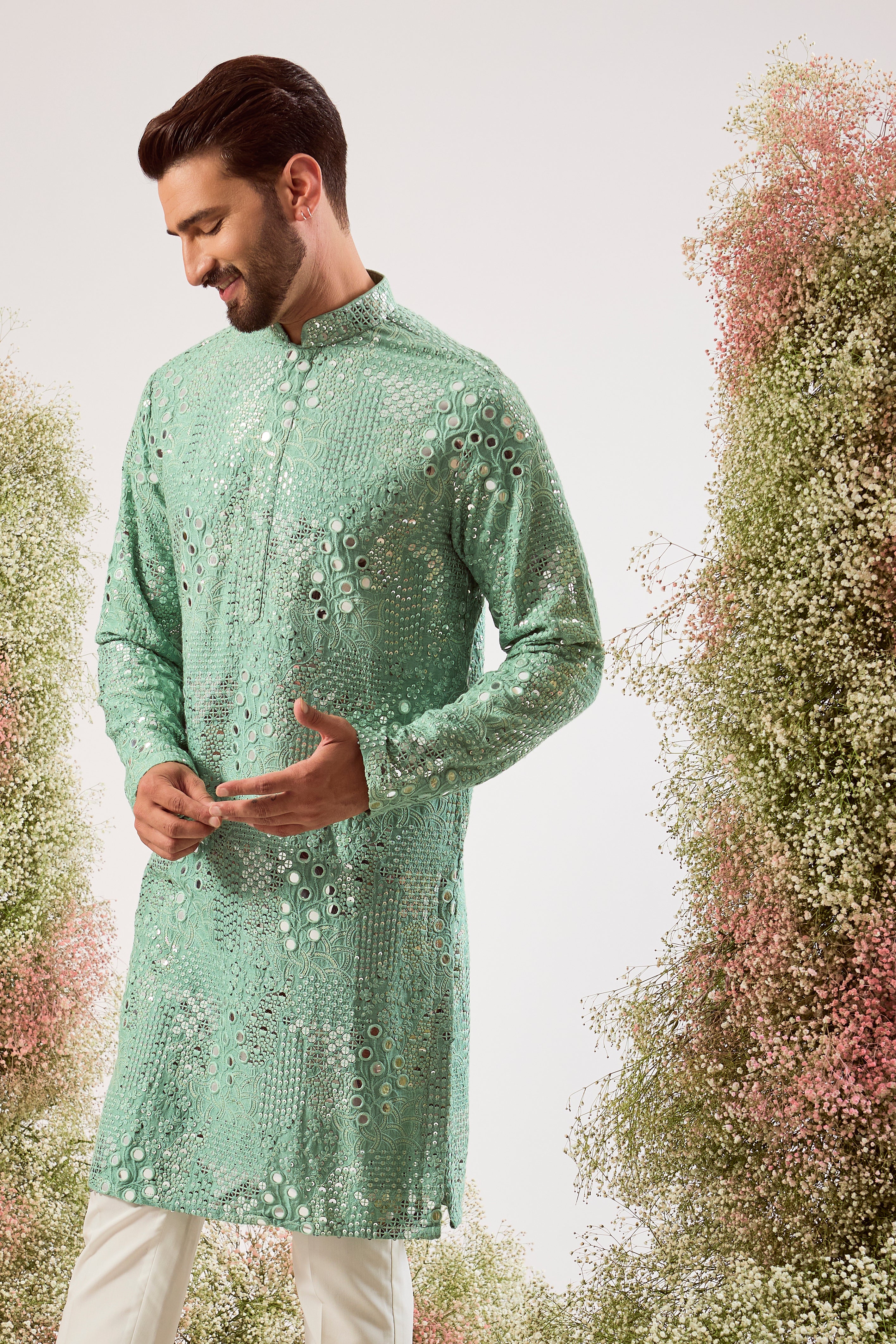 sage green mirror work kurta with intricate floral embroidery and heavy sequin work