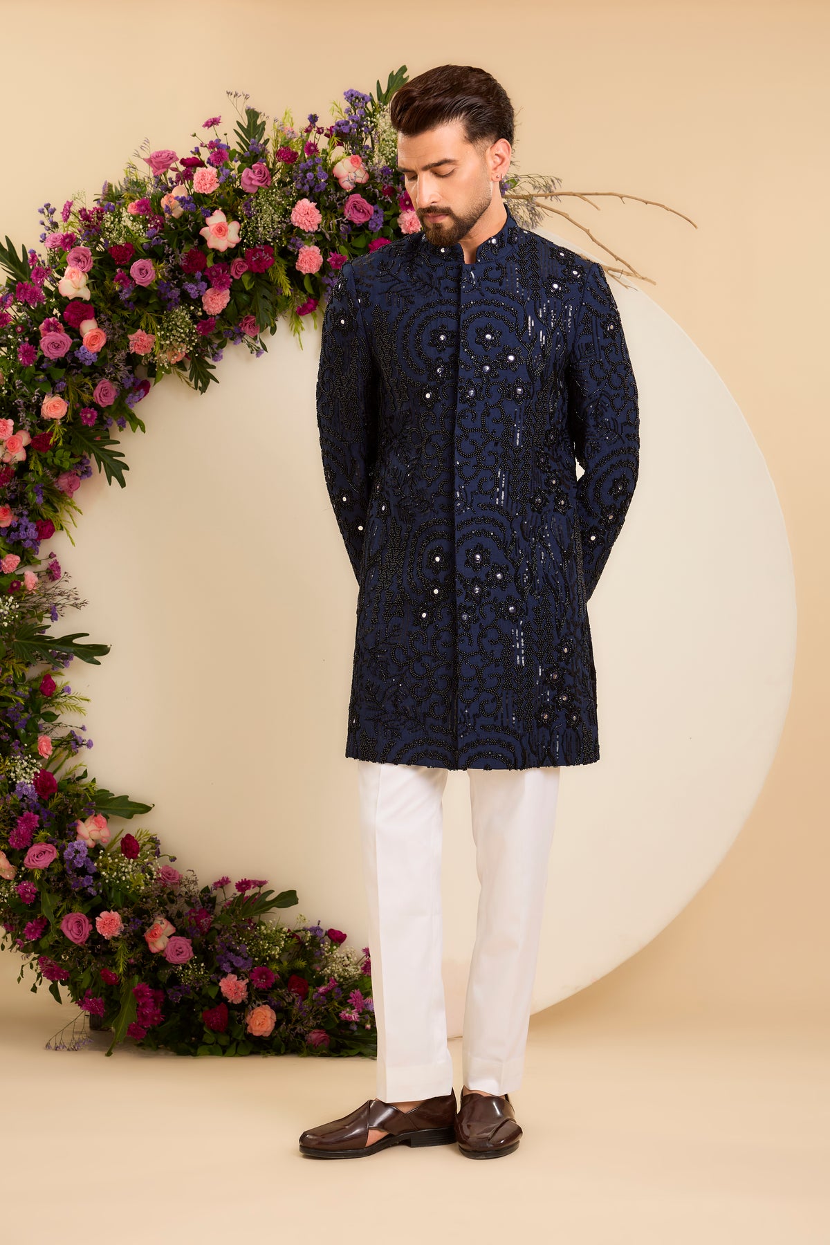 A Navy Short Sherwani Richly Worked in Cut-Dana and Beads