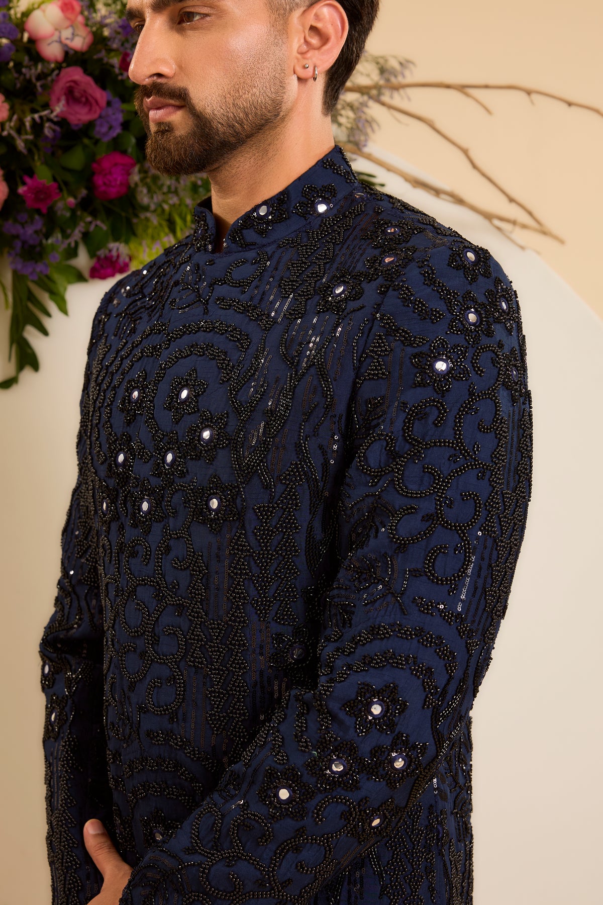 A Navy Short Sherwani Richly Worked in Cut-Dana and Beads