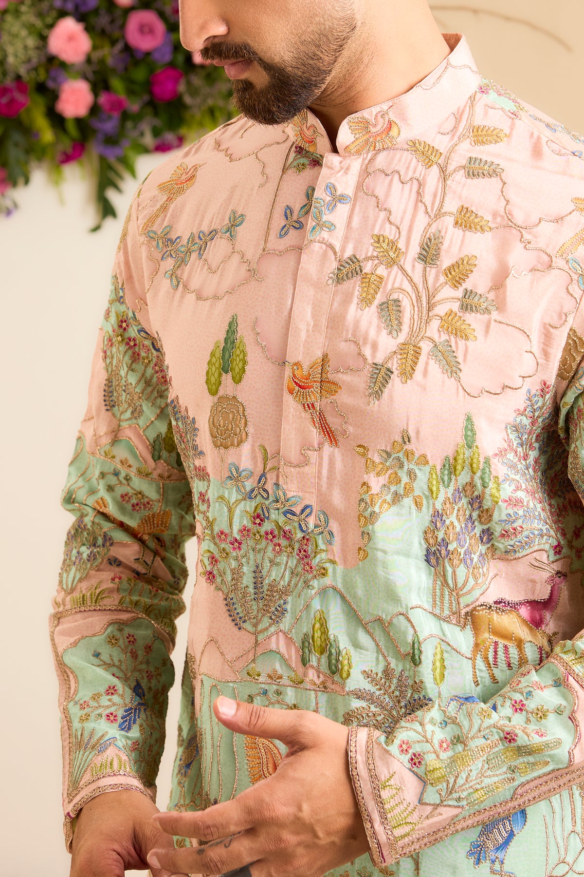 A Vibrant pink Crepe Kurta Richly Embroidered with Wildlife