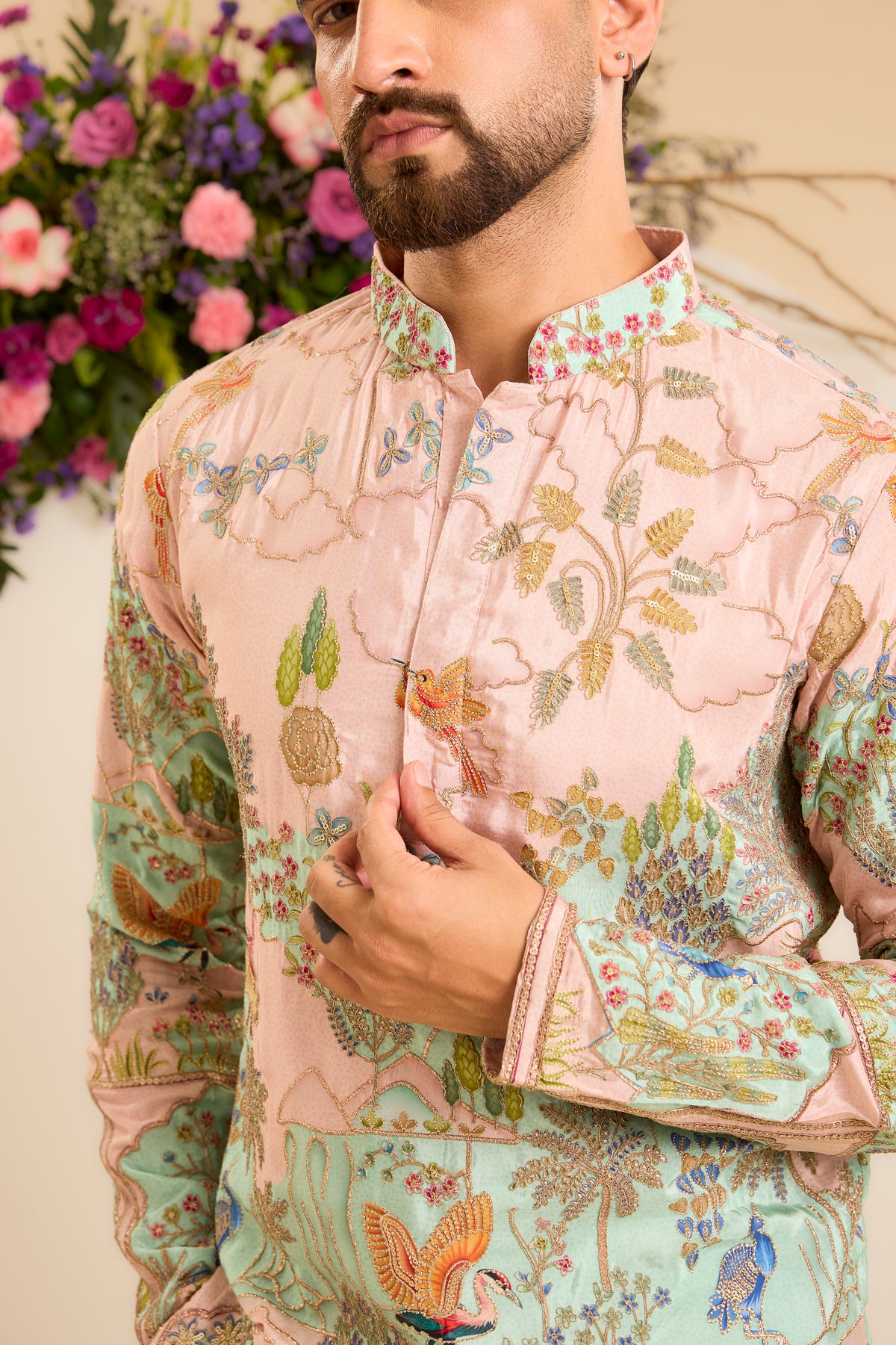 A Vibrant green Crepe short Kurta Richly Embroidered with Wildlife