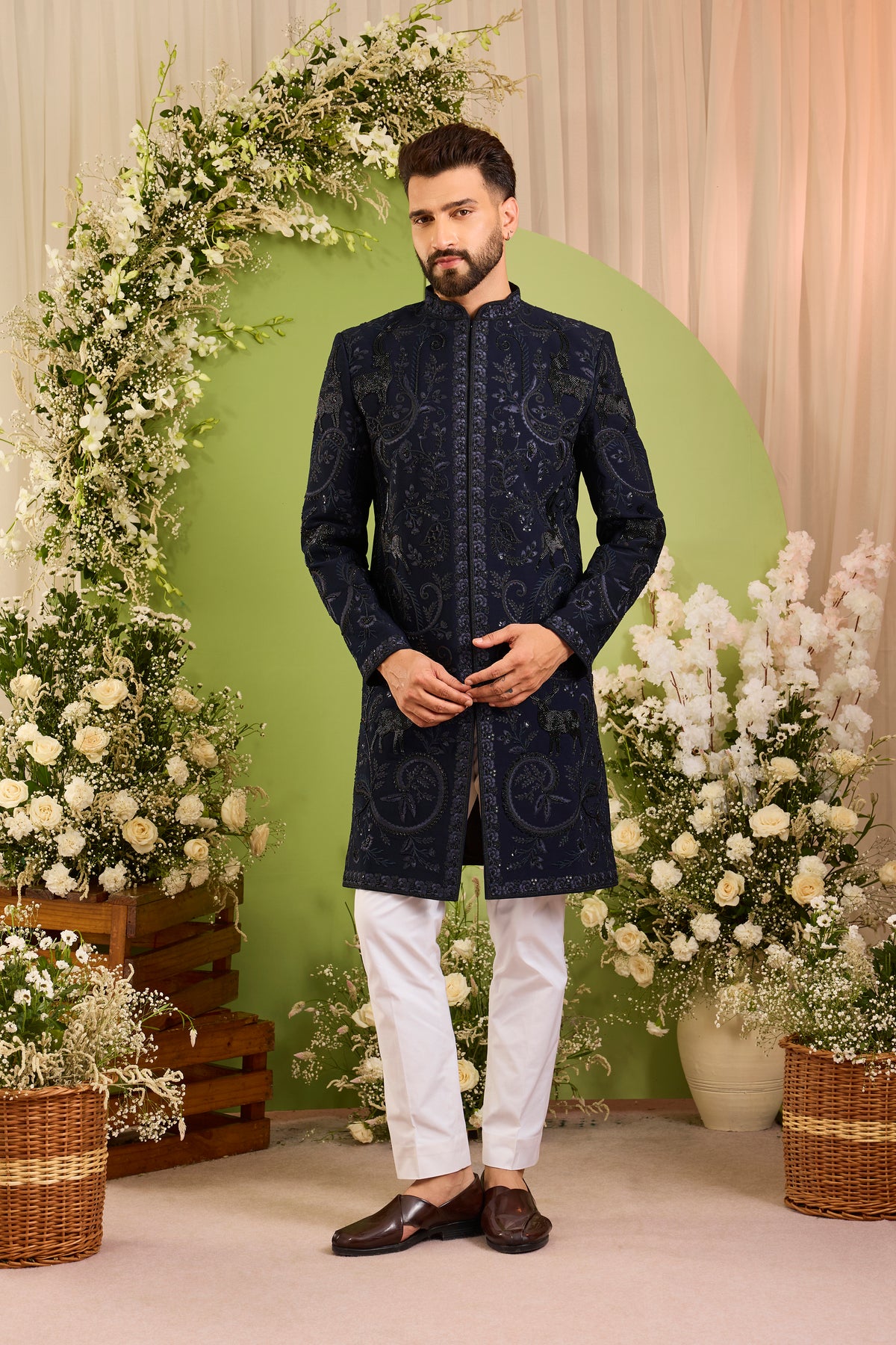 The Royal Crest - A Navy Sherwani Defined by Sculptural Deer Embroidery