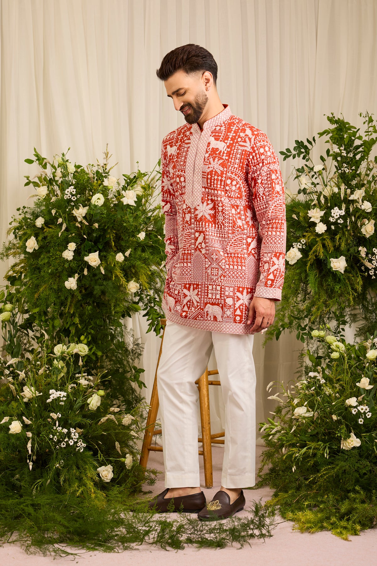 The Imperial — An orange short Kurta Alive with Flora and Fauna