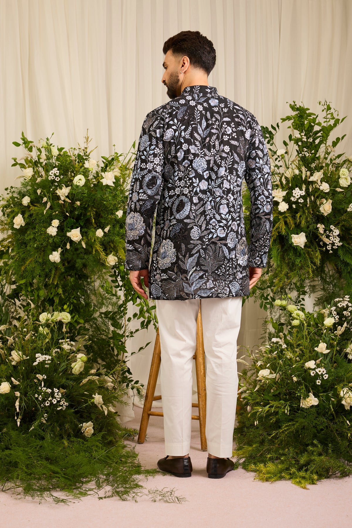 The Calderon — A Black Kurta Draped in Intricate Floral Threadwork