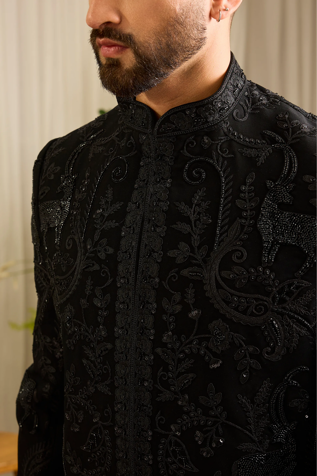 The Royal Crest - Black Sherwani Defined by Sculptural Deer Embroidery