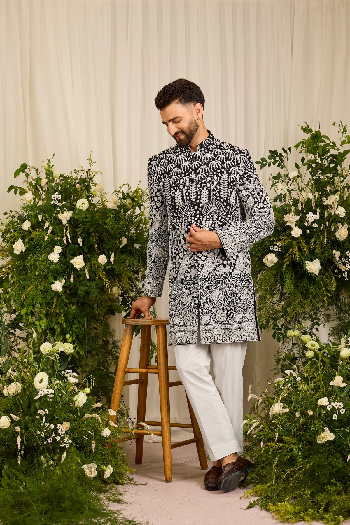The Palais — A black Short Sherwani Richly Worked in Florals