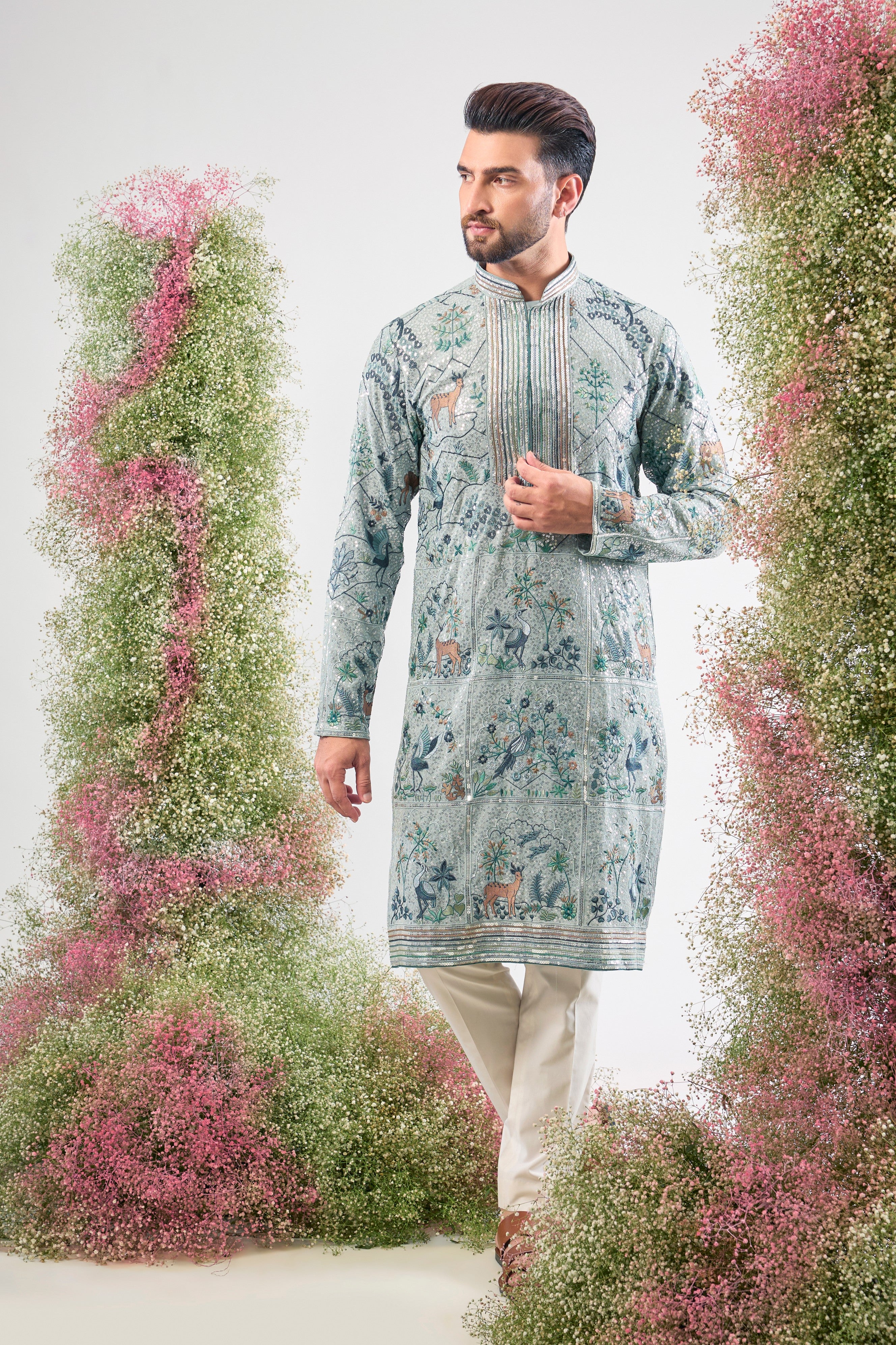blue heavy sequined kurta with intricate flora and fauna embroidery
