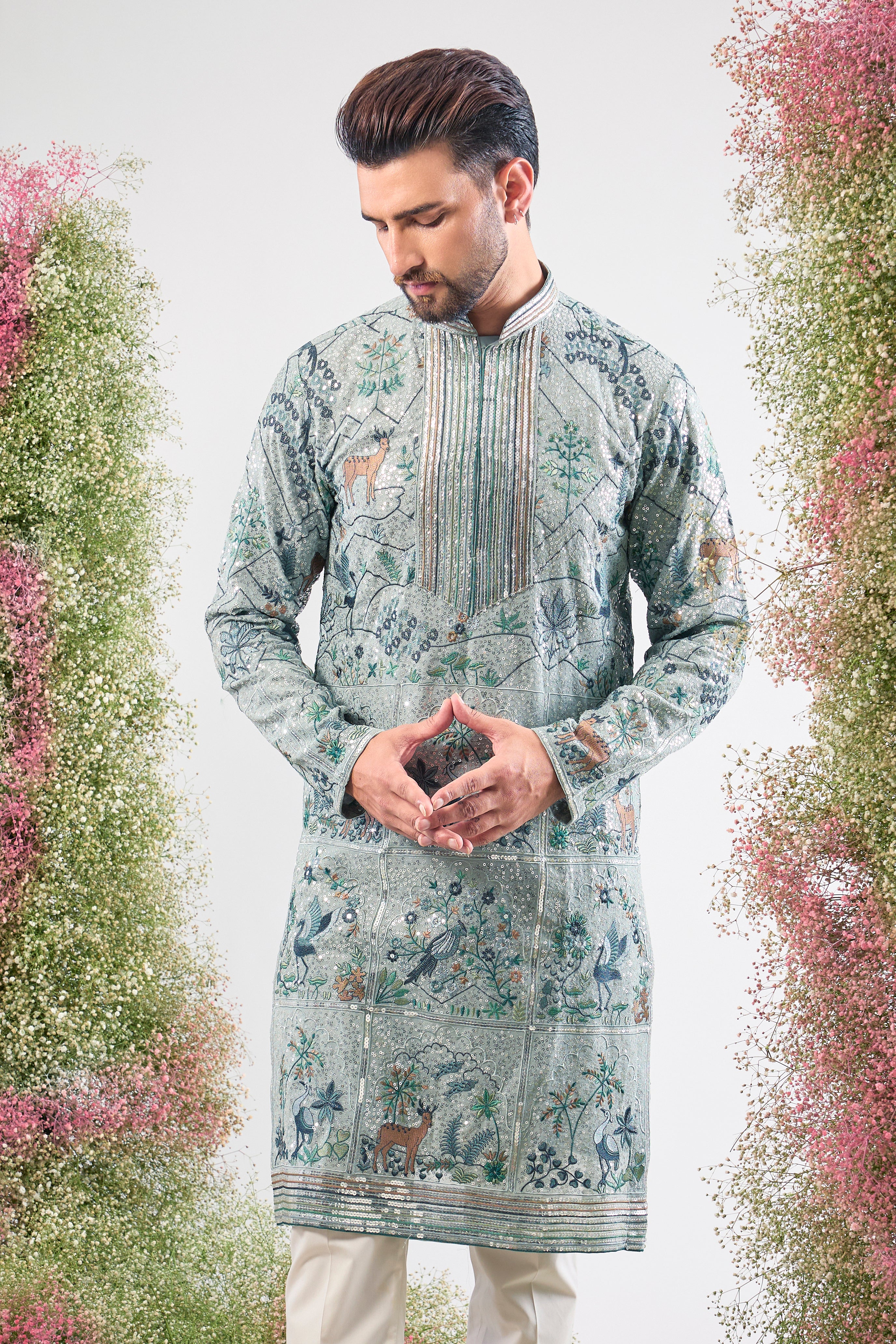 blue heavy sequined kurta with intricate flora and fauna embroidery
