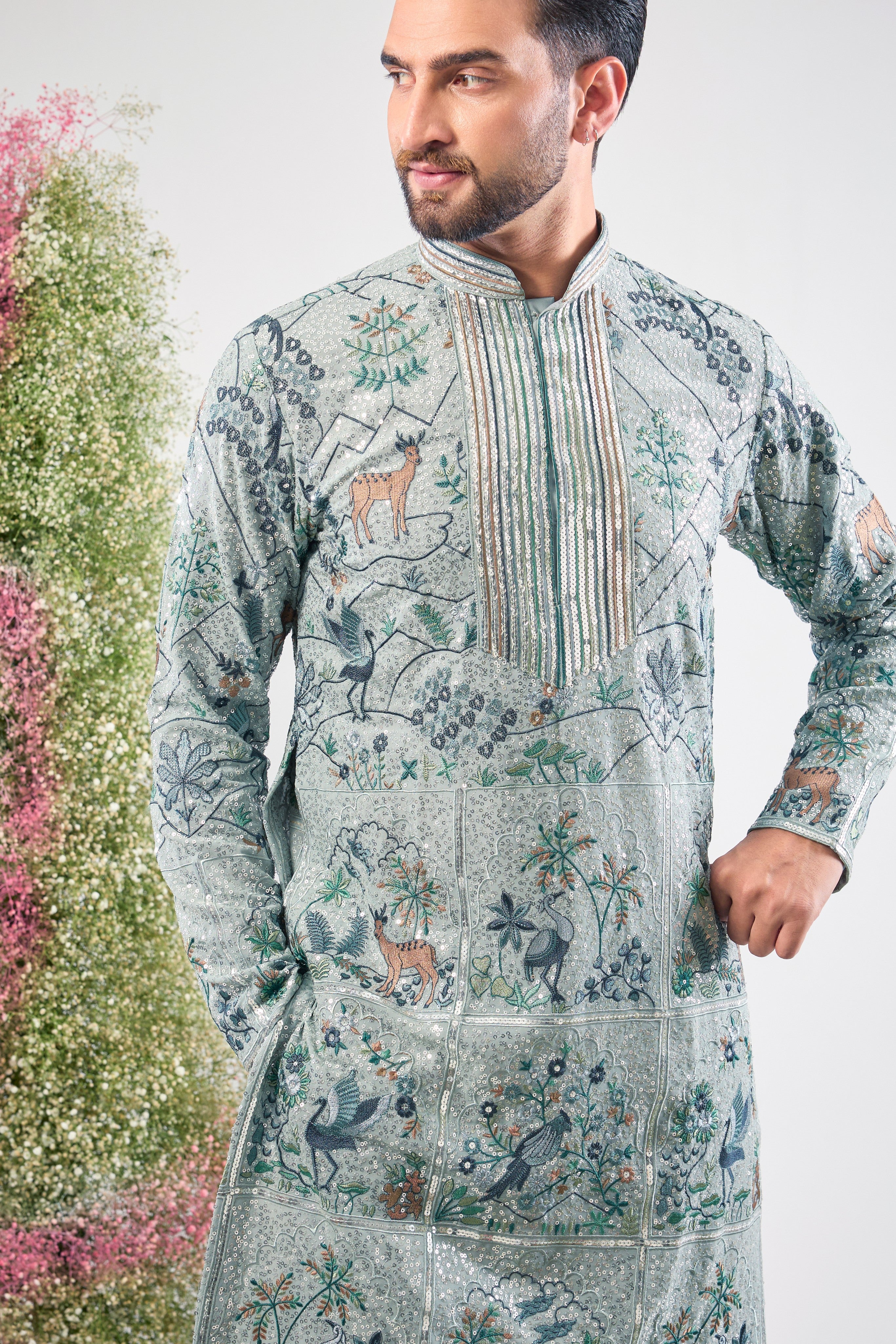 blue heavy sequined kurta with intricate flora and fauna embroidery