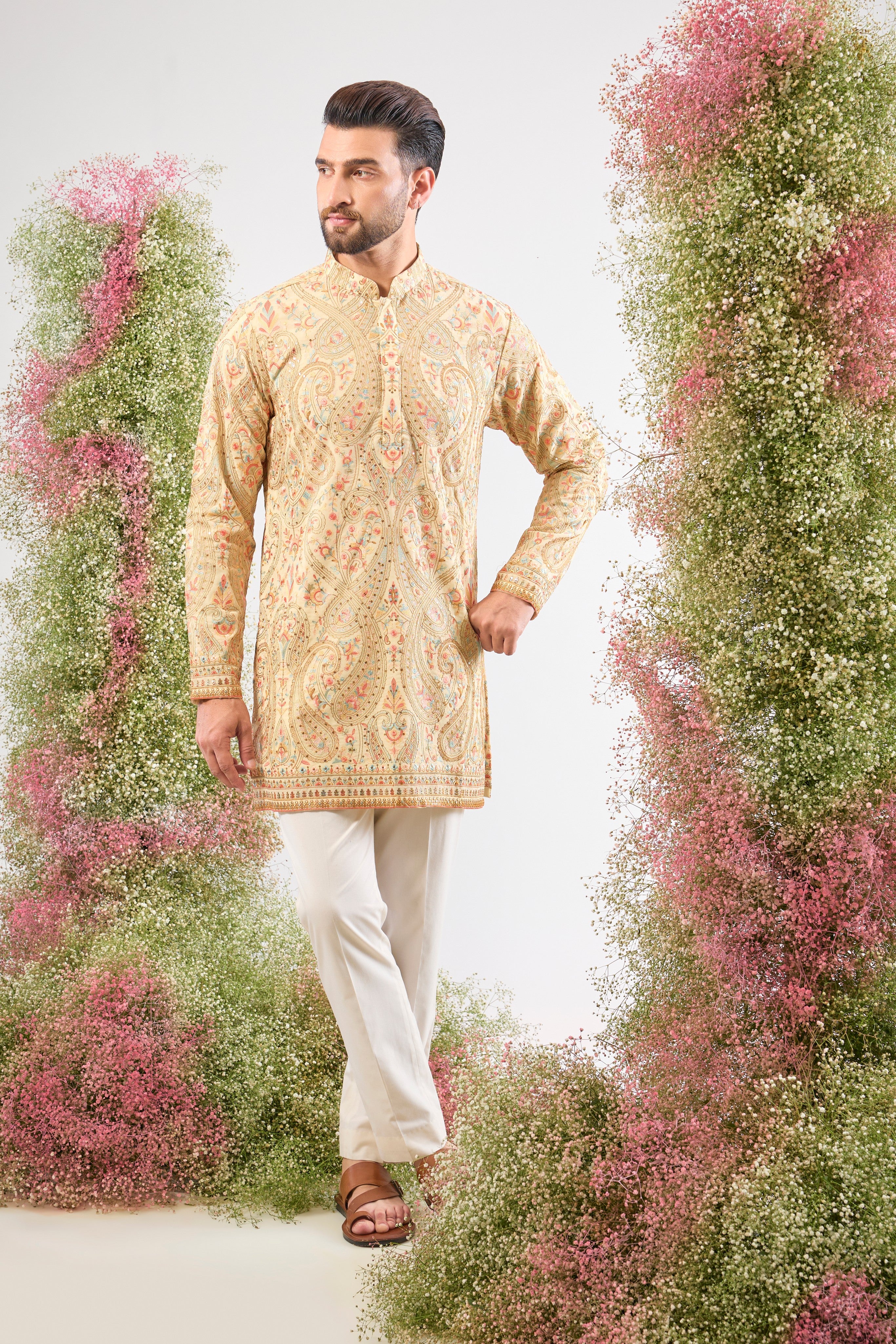 The perfect harmony of colour and craft! This Cream Kashmiri Embroidered Short Kurta showcases intricate patterns using a sophisticated blend of Multi-coloured Thread Work.