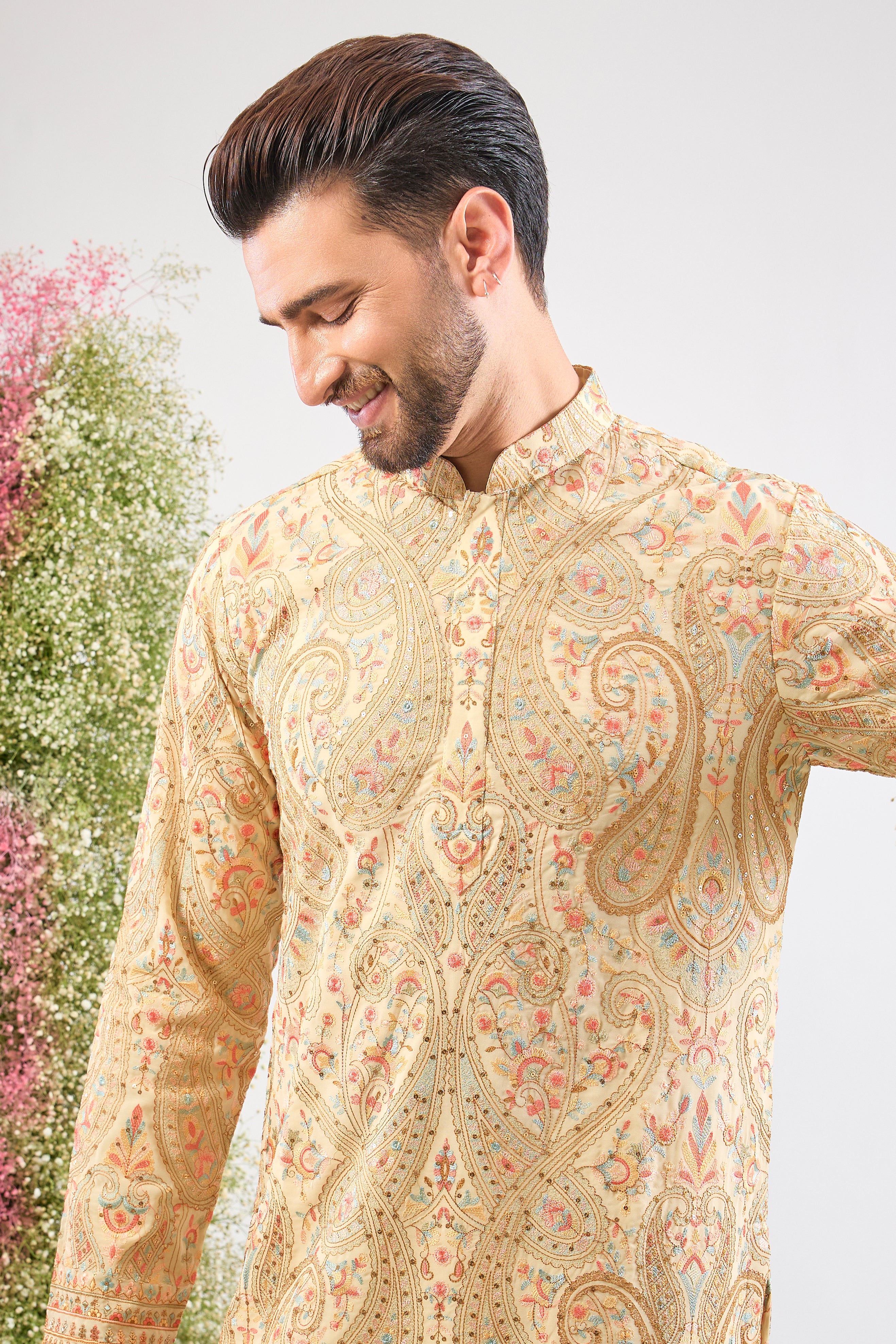 The perfect harmony of colour and craft! This Cream Kashmiri Embroidered Short Kurta showcases intricate patterns using a sophisticated blend of Multi-coloured Thread Work.