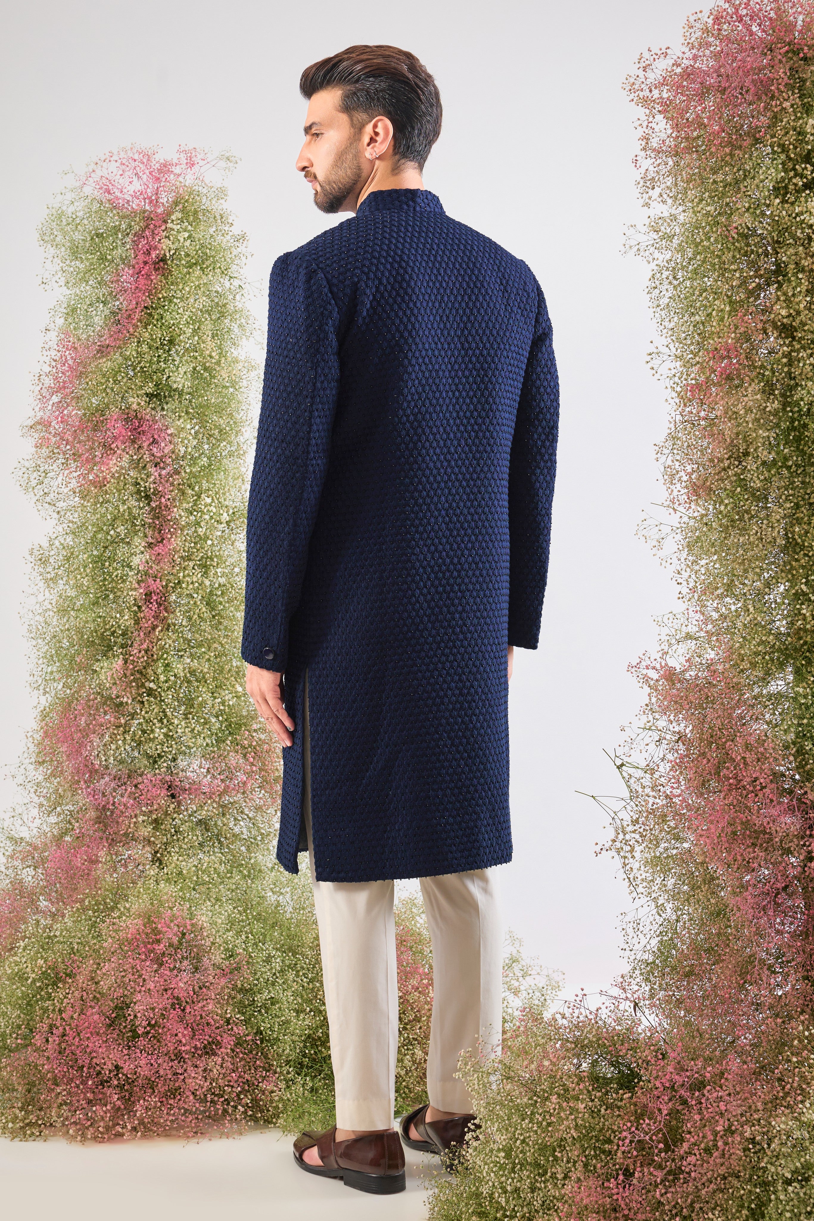 Navy Blue brilliance. This Sherwani features rich Tone-to-Tone Threadwork and sharp Black Cut Dana detailing. Subtly stunning. 💎