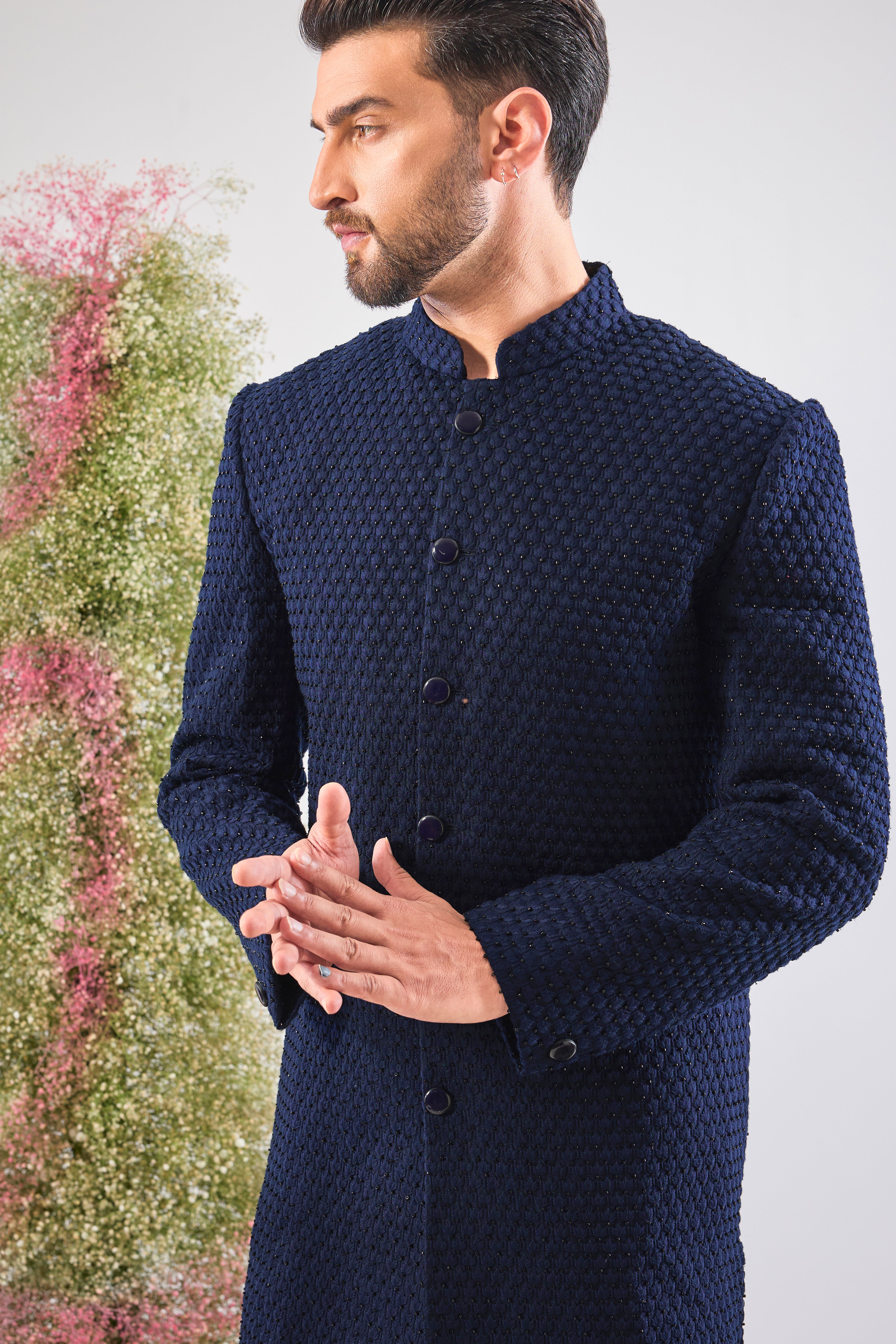 Navy Blue brilliance. This Sherwani features rich Tone-to-Tone Threadwork and sharp Black Cut Dana detailing. Subtly stunning. 💎