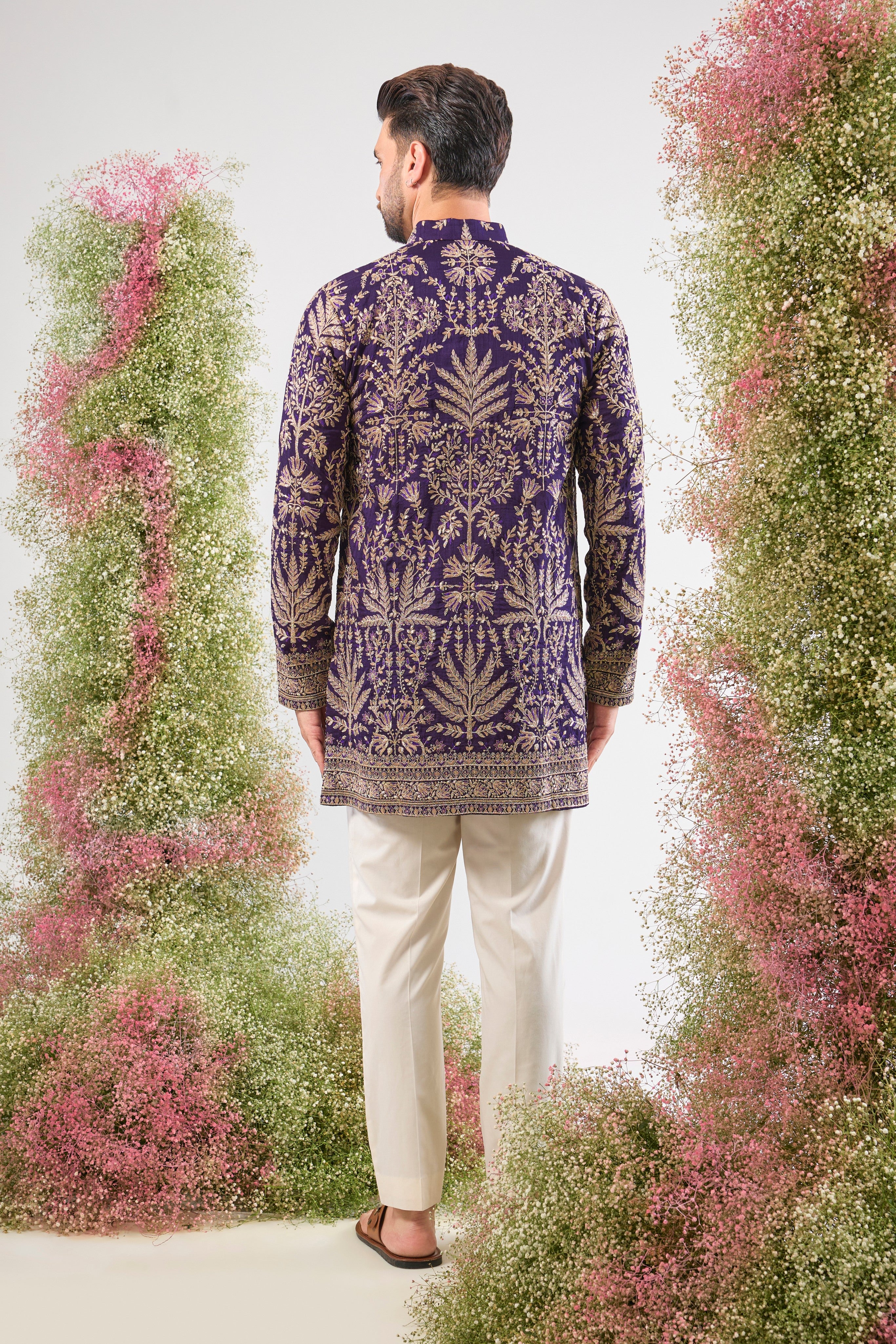 Purple perfection. Our Short Kurta shines with Heavy Zari Work, elegant Detailed Floral Embroidery, and a dash of Subtle Sequins. Unforgettable style.