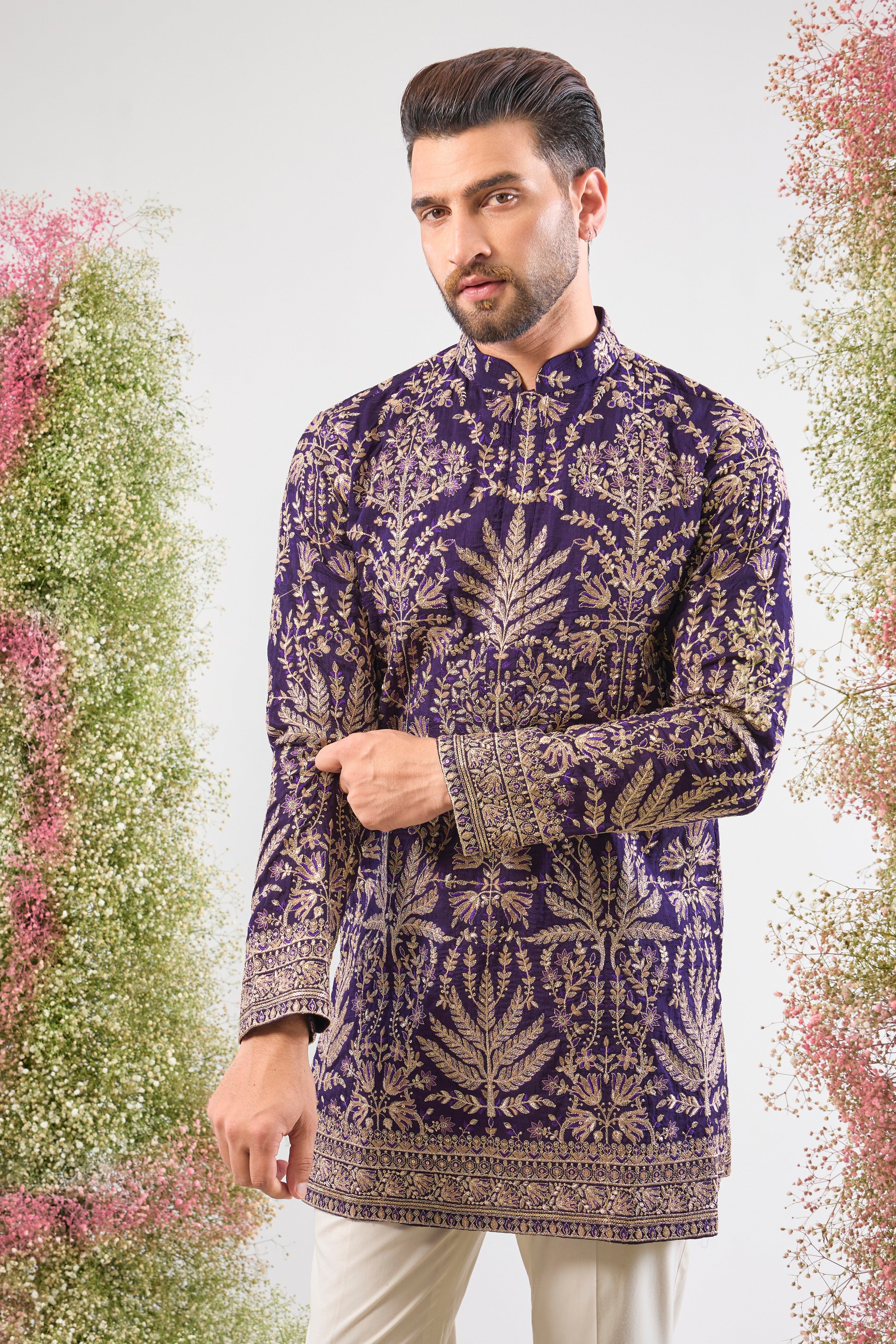 Purple perfection. Our Short Kurta shines with Heavy Zari Work, elegant Detailed Floral Embroidery, and a dash of Subtle Sequins. Unforgettable style.