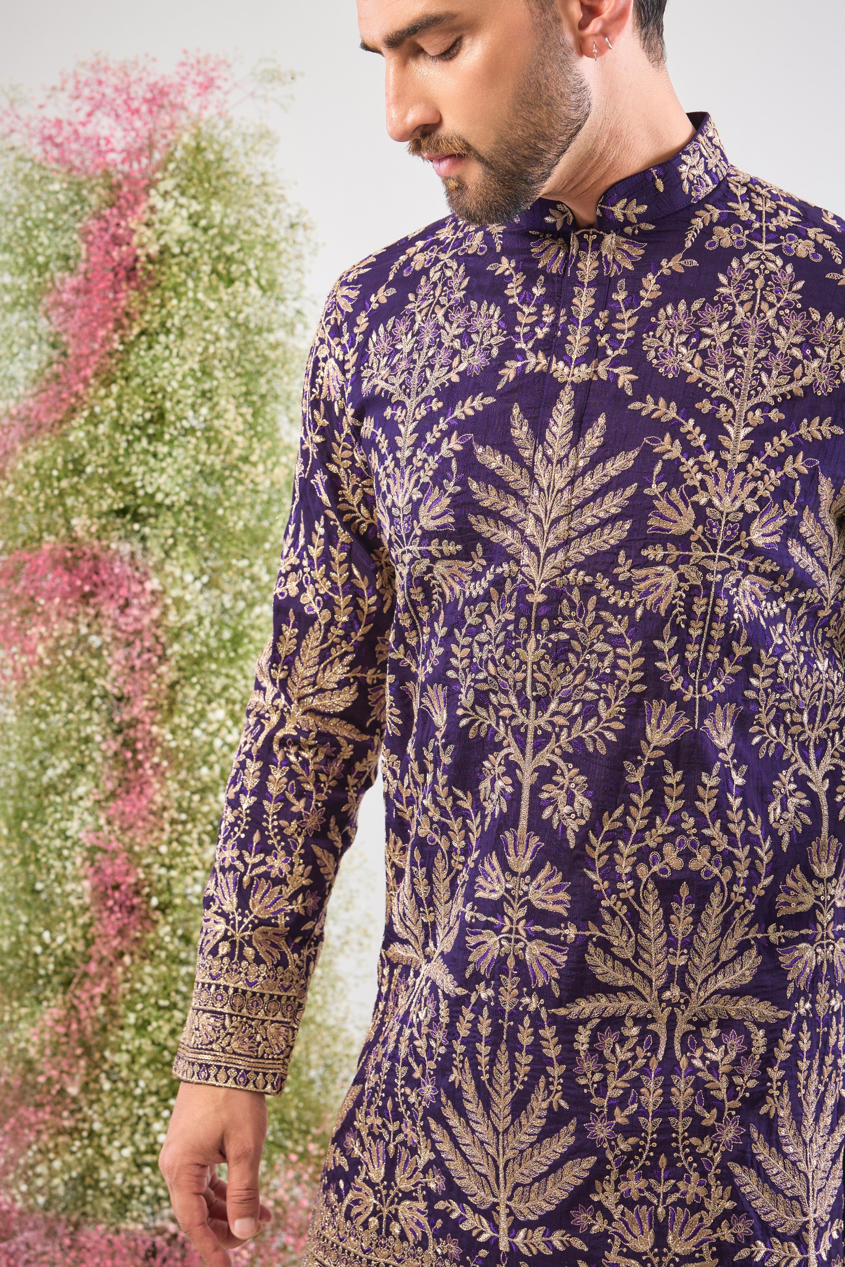 Purple perfection. Our Short Kurta shines with Heavy Zari Work, elegant Detailed Floral Embroidery, and a dash of Subtle Sequins. Unforgettable style.